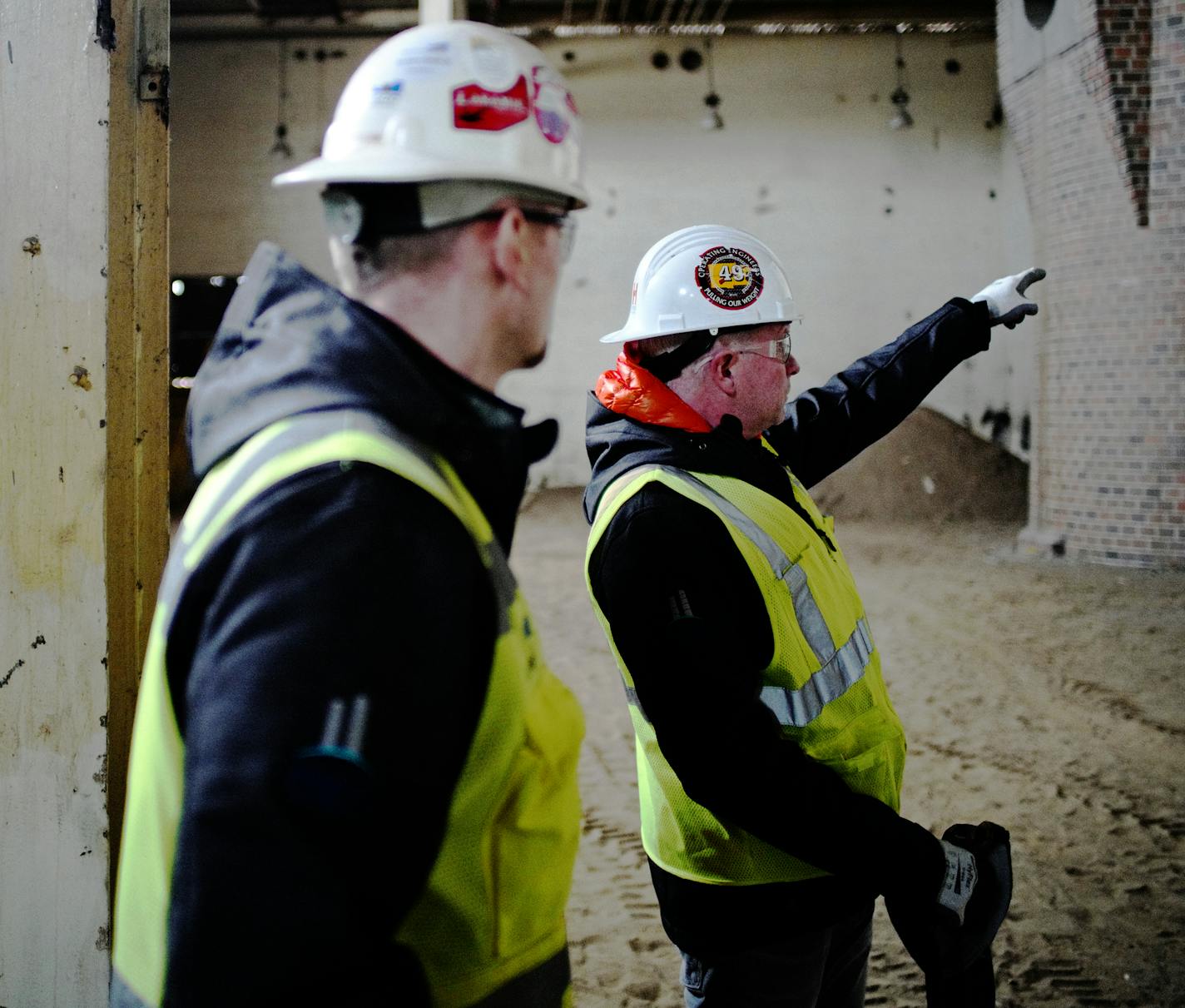 Hyde president Paul Hyde shows off Northern Stacks' historic past as highlighted by this boiler building where a brewery will be housed.] Light cascades from multiple skylights. . Workers warm up by the fire on an outdoor patio. While the features sound like comforts offered in the swank office towers of downtown, these amenities have started to crop up in the newer Twin Cities industrial parks of manufacturers and distributors.Richard Tsong-Taatarii/richard.tsong-taatarii@startribune.com