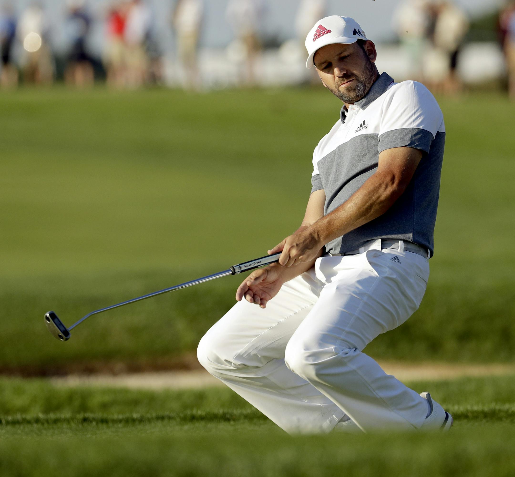 Sergio Garcia, of Spain, missed a birdie putt on the fourth hole during the rain delayed second round of the U.S. Open golf championship at Oakmont Country Club on Friday, June 17, 2016, in Oakmont, Pa. (AP Photo/Charlie Riedel)