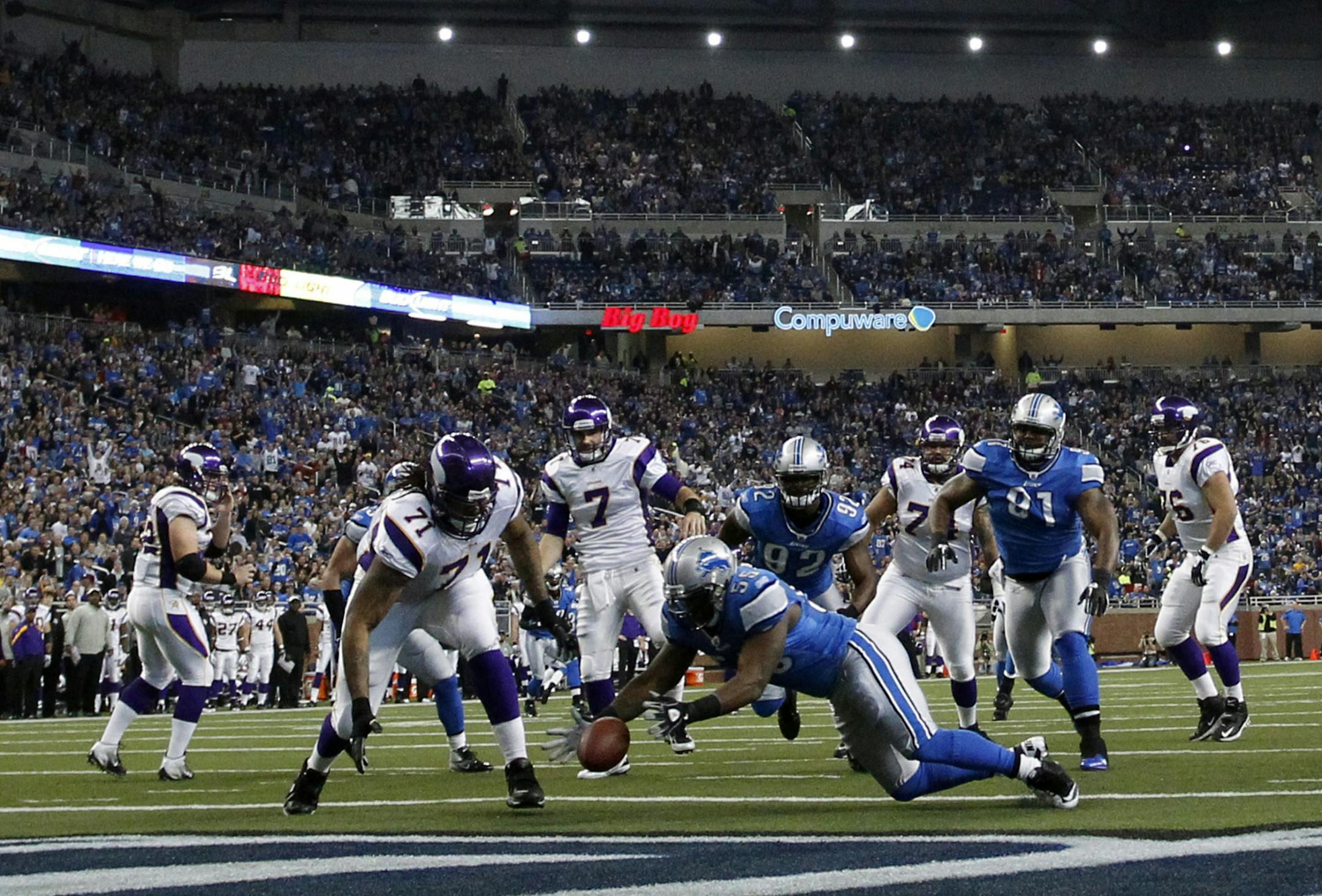 Detroit Lions middle linebacker Stephen Tulloch (55) falls on the ball in the endzone for a touchdown during the first quarter of an NFL football game against the Minnesota Vikings in Detroit, Sunday, Dec. 11, 2011.
