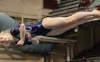 Champlin Park's Chaney Neu mid-jump during the floor exercise, in which she placed first at the Class 2A All-Around championship. ] Photo By: Matt Web