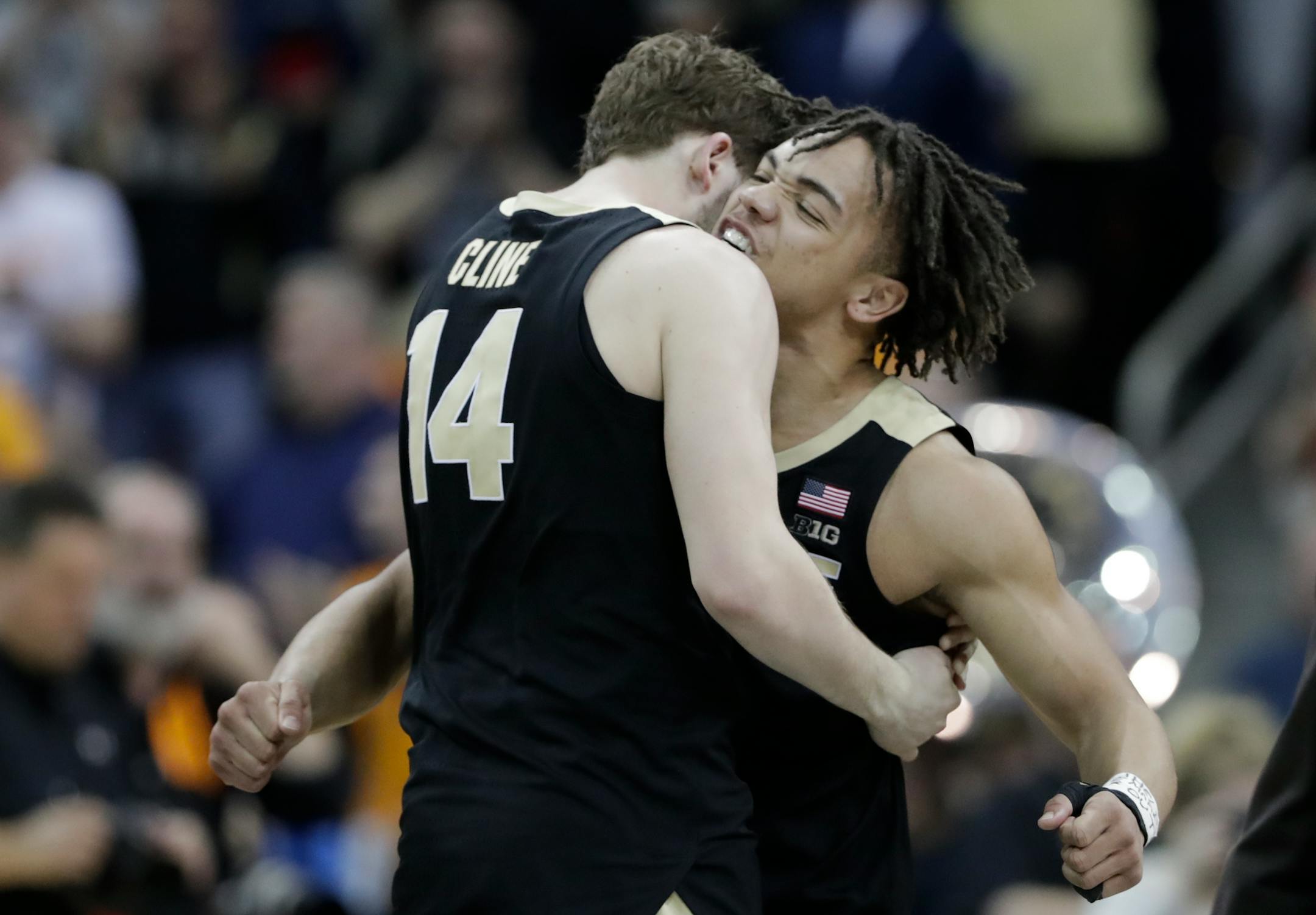 Purdue's Ryan Cline (14) and Carsen Edwards celebrate after defeating Tennessee 99-94 in overtime of a men's NCAA Tournament college basketball South Regional semifinal game Thursday, March 28, 2019, in Louisville, Ky. (AP Photo/Michael Conroy)
