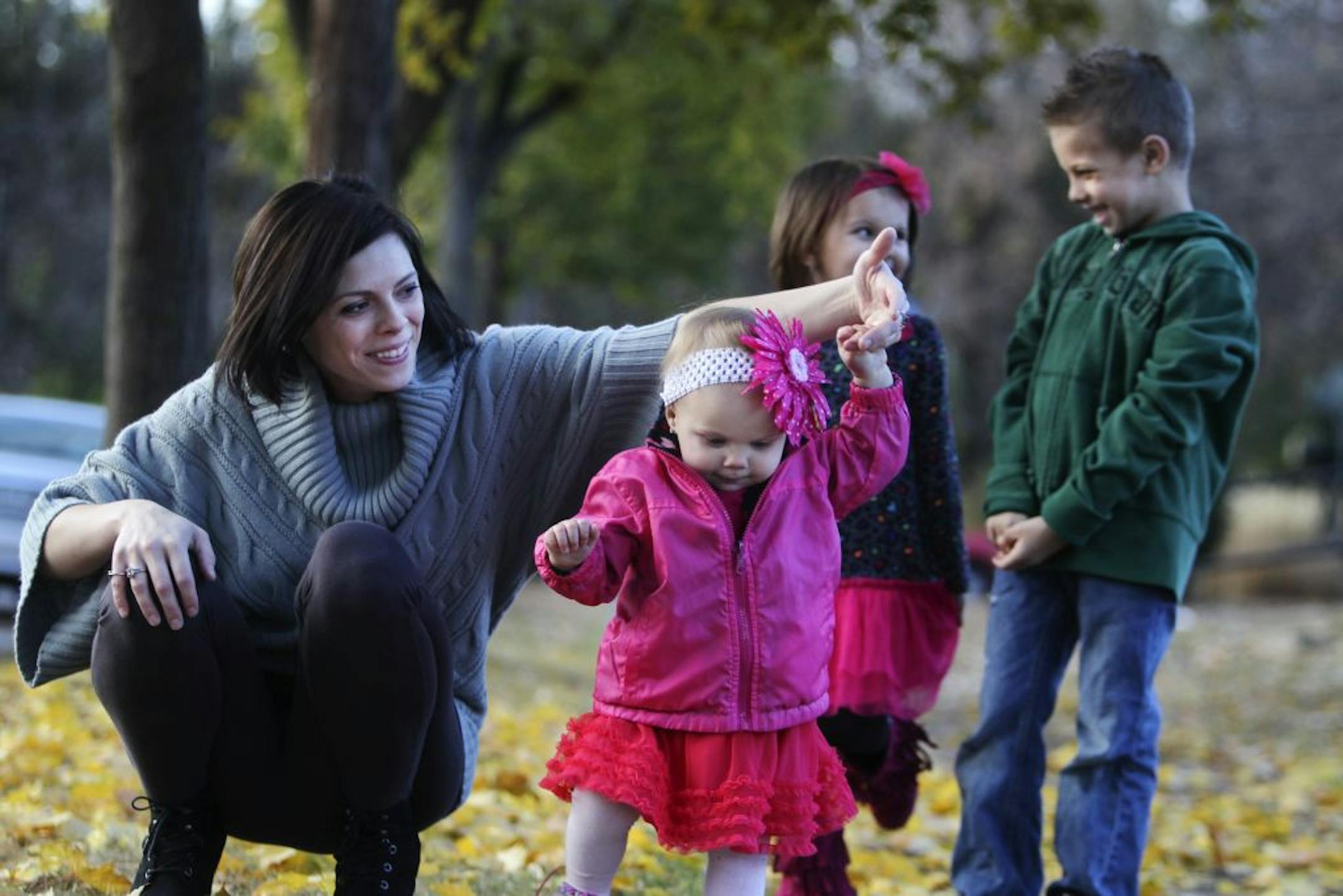 Nichole Baker, a 27-year-old woman who benefited from the Face-To-Face Clinic's services when she was 19 and pregnant. Baker is seen with her three children Kaden, 7, Bailey, 4, and Paige, 1 near their home Friday, Oct. 19, 2012, in Minneapolis, MN.