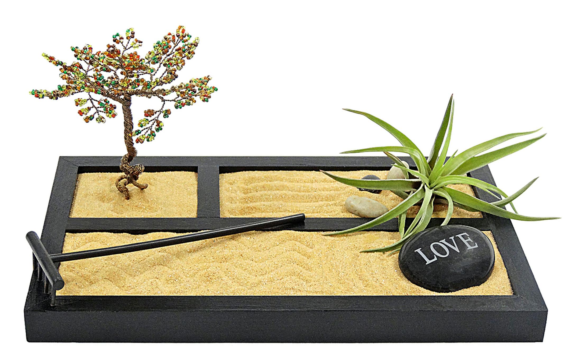 Luludi Living Art has taken the idea of a small, traditional Zen garden and expanded it by adding an air plant (Tillandsia), which requires little maintenance -- no direct sun, a quick spritz of water each week. It's a mini-oasis for the home or office. This one is $55 at lululdi.net. The site has many other designs, priced from $40 to $65. (Photo courtesy Luludi Living Art/TNS) ORG XMIT: 1177062
