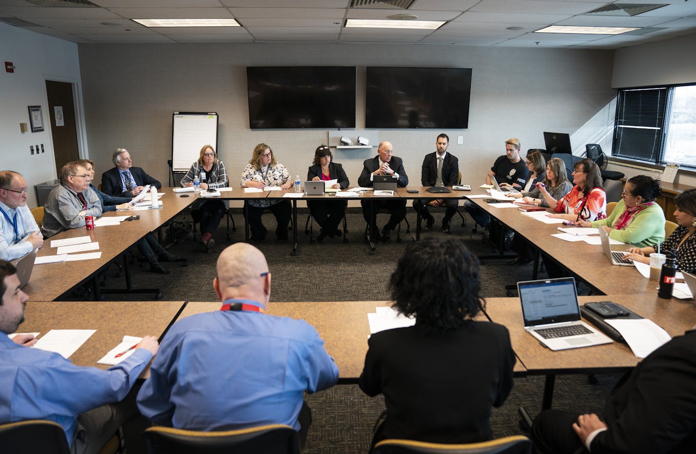 Commissioner Paul Schnell and his executive team sat around a table for their daily briefing on coronavirus preparations at the Department of Corrections headquarters, Minn., on Wednesday, March 11, 2020.