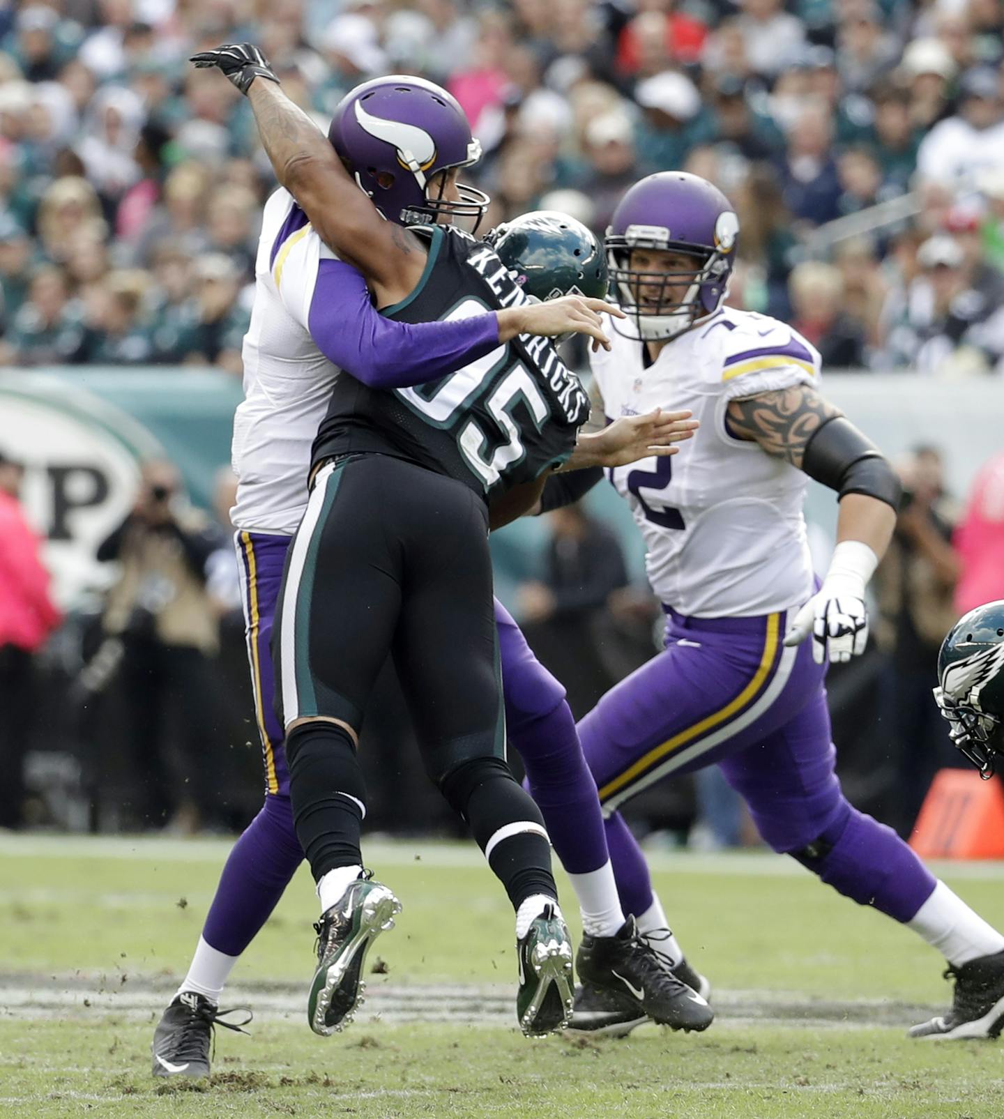 FILE - In this Oct. 23, 2016, file photo, Minnesota Vikings' Sam Bradford, center, fumbles the ball against Philadelphia Eagles' Mychal Kendricks, right, and Rodney McLeod during the first half of an NFL football game in Philadelphia. Minnesota's biggest weakness, the patched-together offensive line, was exposed in the team's first loss. (AP Photo/Chris Szagola, File)