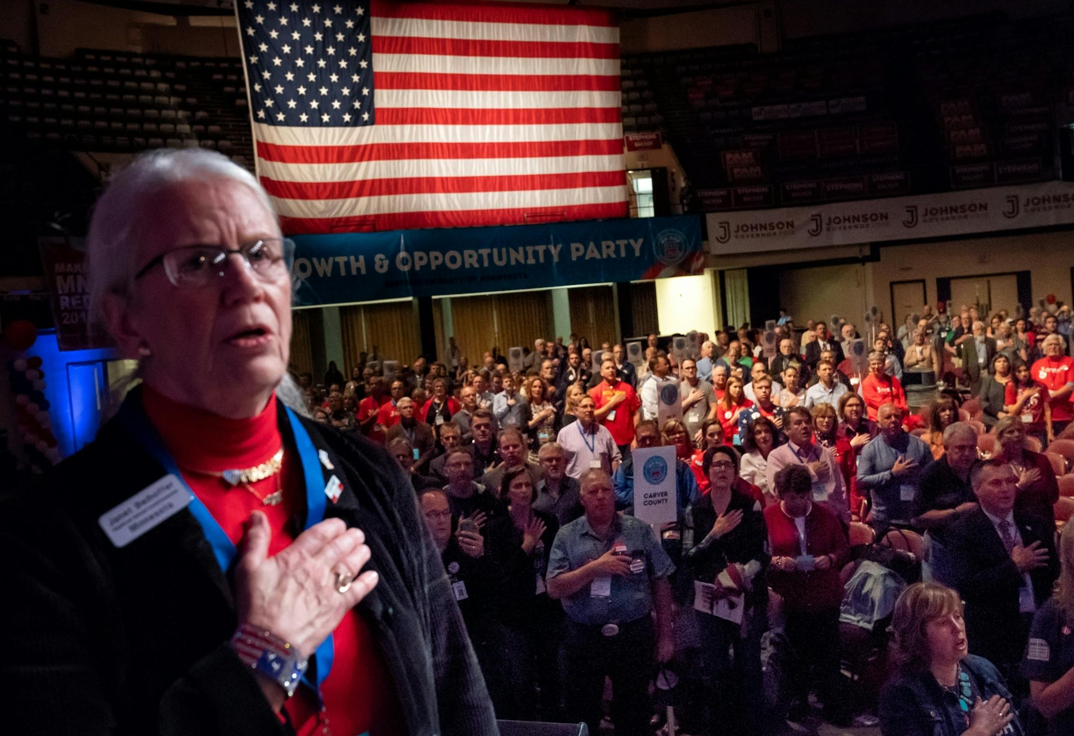 Delegates sang the Star Spangled Banner at the beginning of the Republican state convention in Duluth. On the left is Janet Beihoffer, Republican National Committeewoman.