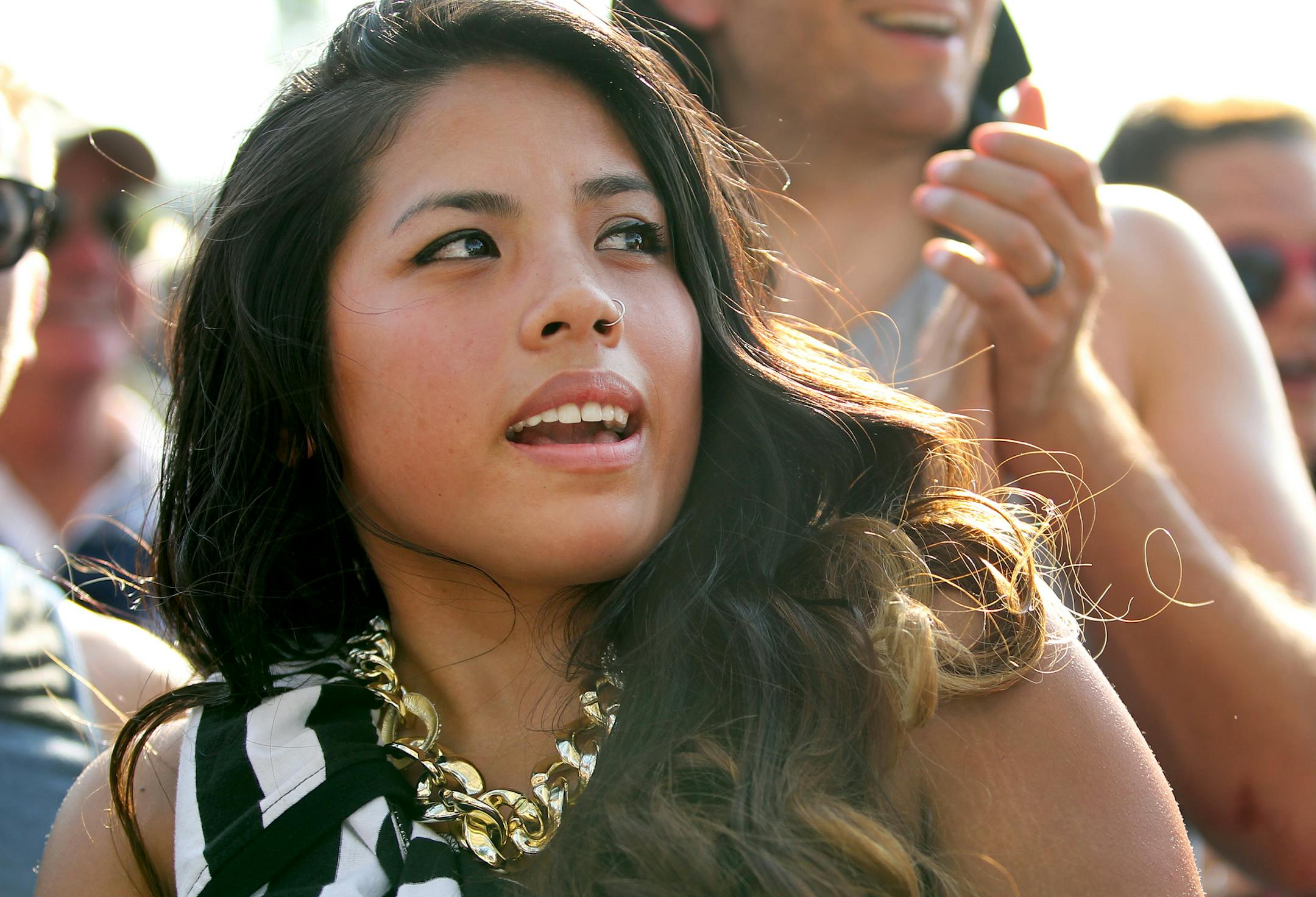 Thuy Henderson, of Minneapolis, sings along as Mayer Hawthorne performs during the Basilica Block Party at Basilica of St. Mary church in Minneapolis, Minn., on Friday, July 12, 2013. ] (ANNA REED/STAR TRIBUNE) anna.reed@startribune.com (cq)
