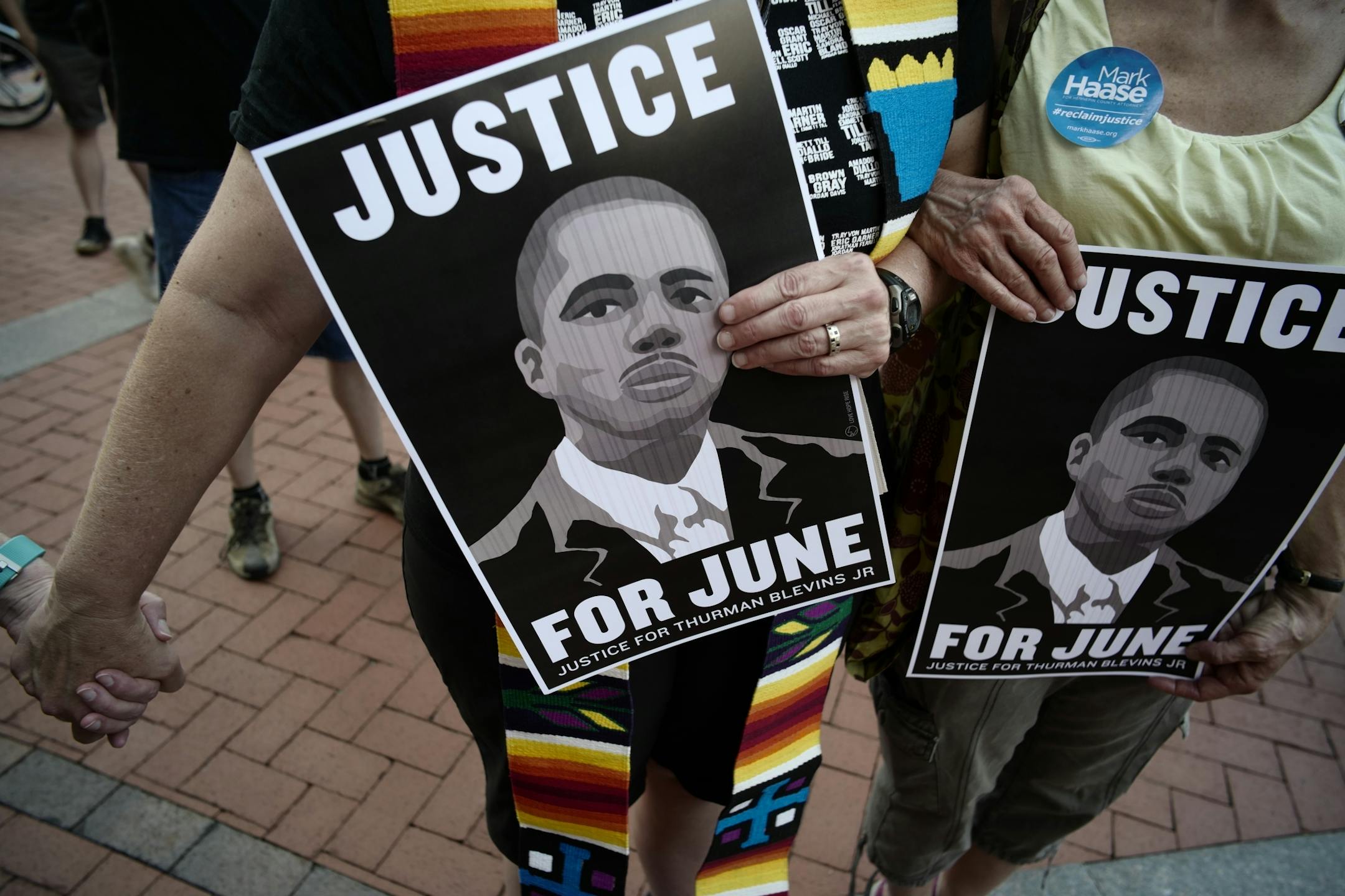 Pastor Rebecca Voelkel who held a sign for Thurman Blevins, said,"they seem to to able to arrest white suspects" of Blevins' death after being chased by two Minneapolis cops.
