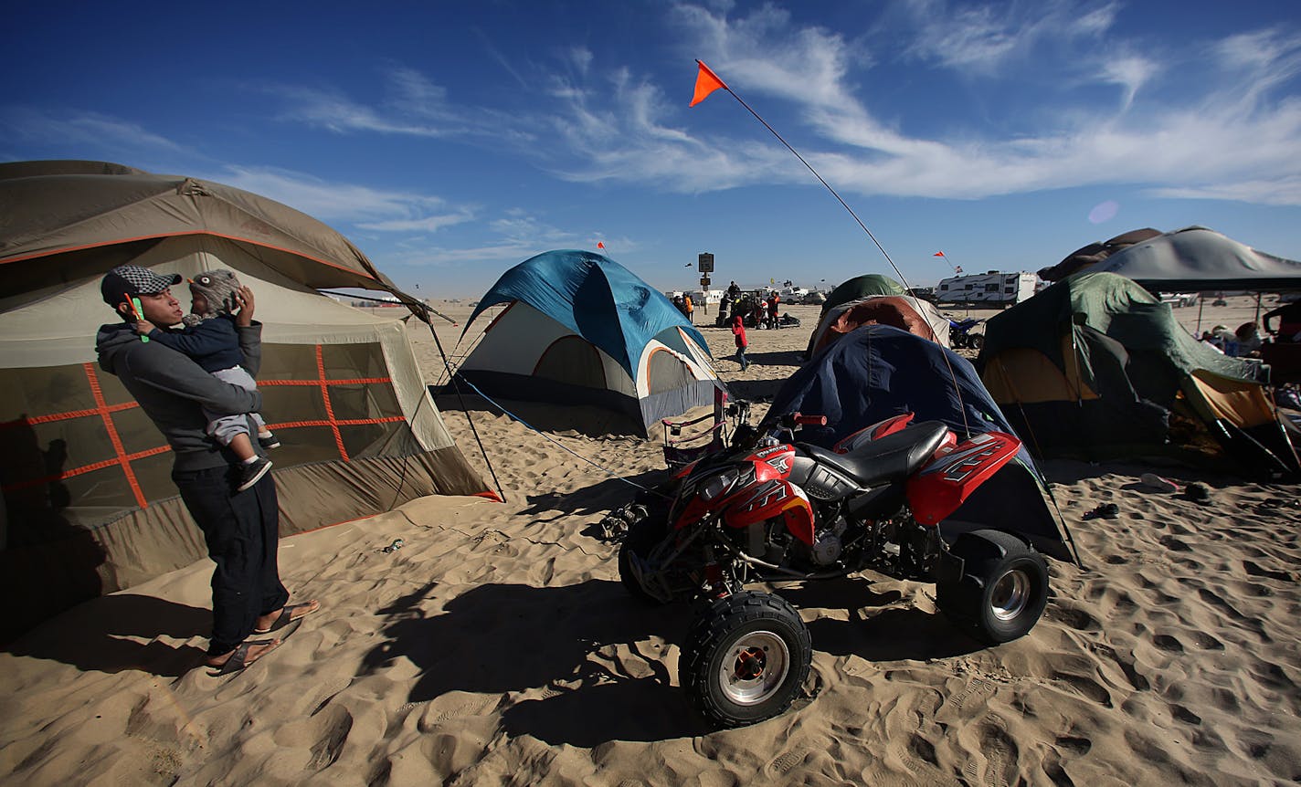 Many ATV riders who came to the Oceano Dunes park for Labor Day weekend set up campsites along the beach near the ocean. ] JIM GEHRZ &#x201a;&#xc4;&#xa2; jgehrz@startribune.com / San Luis Obispo, CA 8/31, 2014 /1:00 PM / BACKGROUND INFORMATION: Trip to San Luis Obispo, CA, to cover ATV scene at Oceano Dunes State Vehicular Recreation Area along the Pacific Ocean. Also interviewed Dr. Larry Foreman, an ER physician at nearby Arroyo Grande Community Hospital about treating ATV injuries. Foreman, a