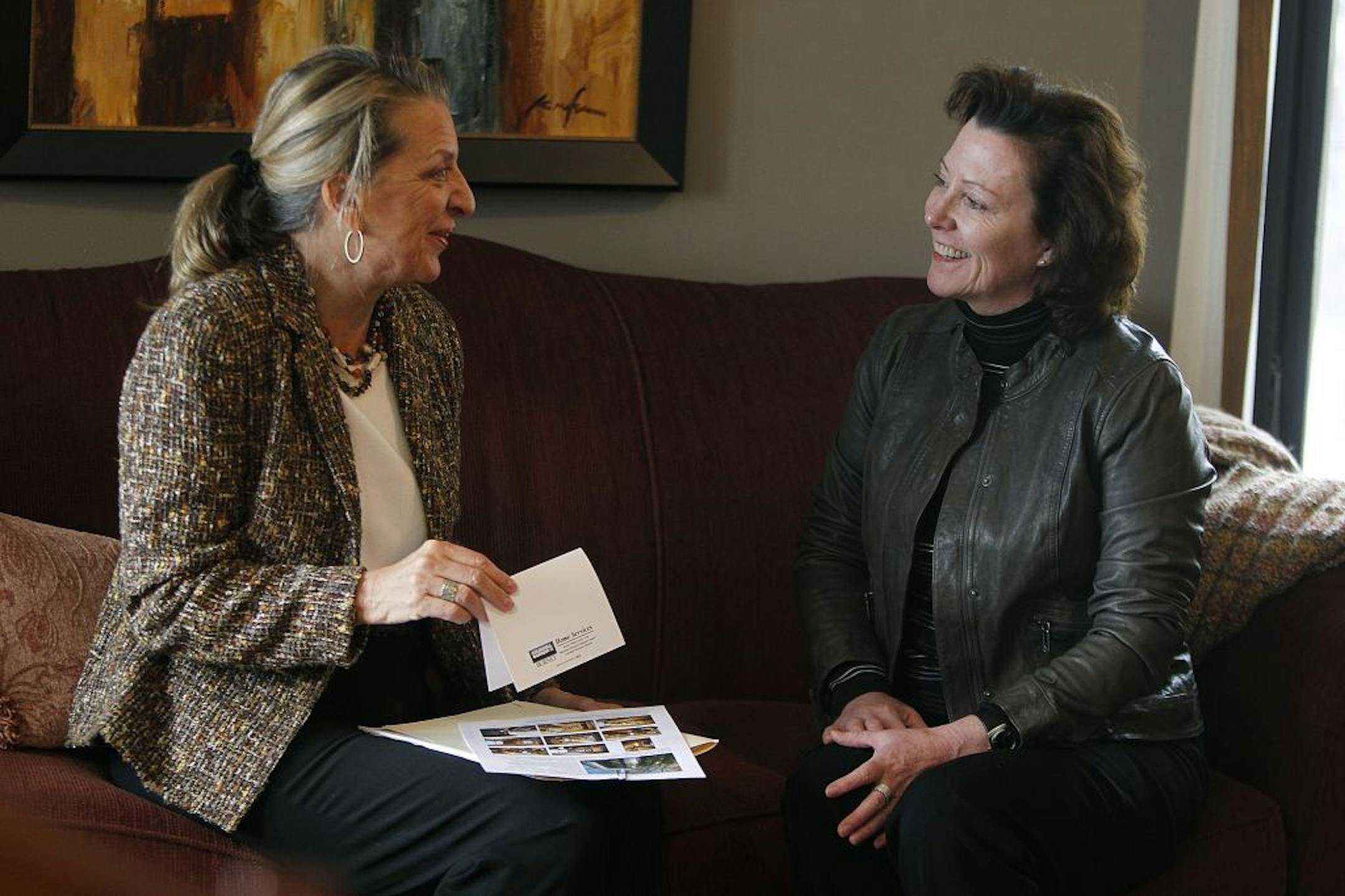 Realtor Barb Dahlquist, left, and client Robin Nelson prepared for an open house. Sellers are regaining confidence in the market.