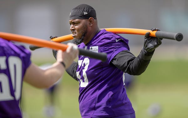 Vederian Lowe warms up on the practice field during the Vikings rookie minicamp at the TCO Performance Center, in Eagan, Minn., on Friday, May 13, 202