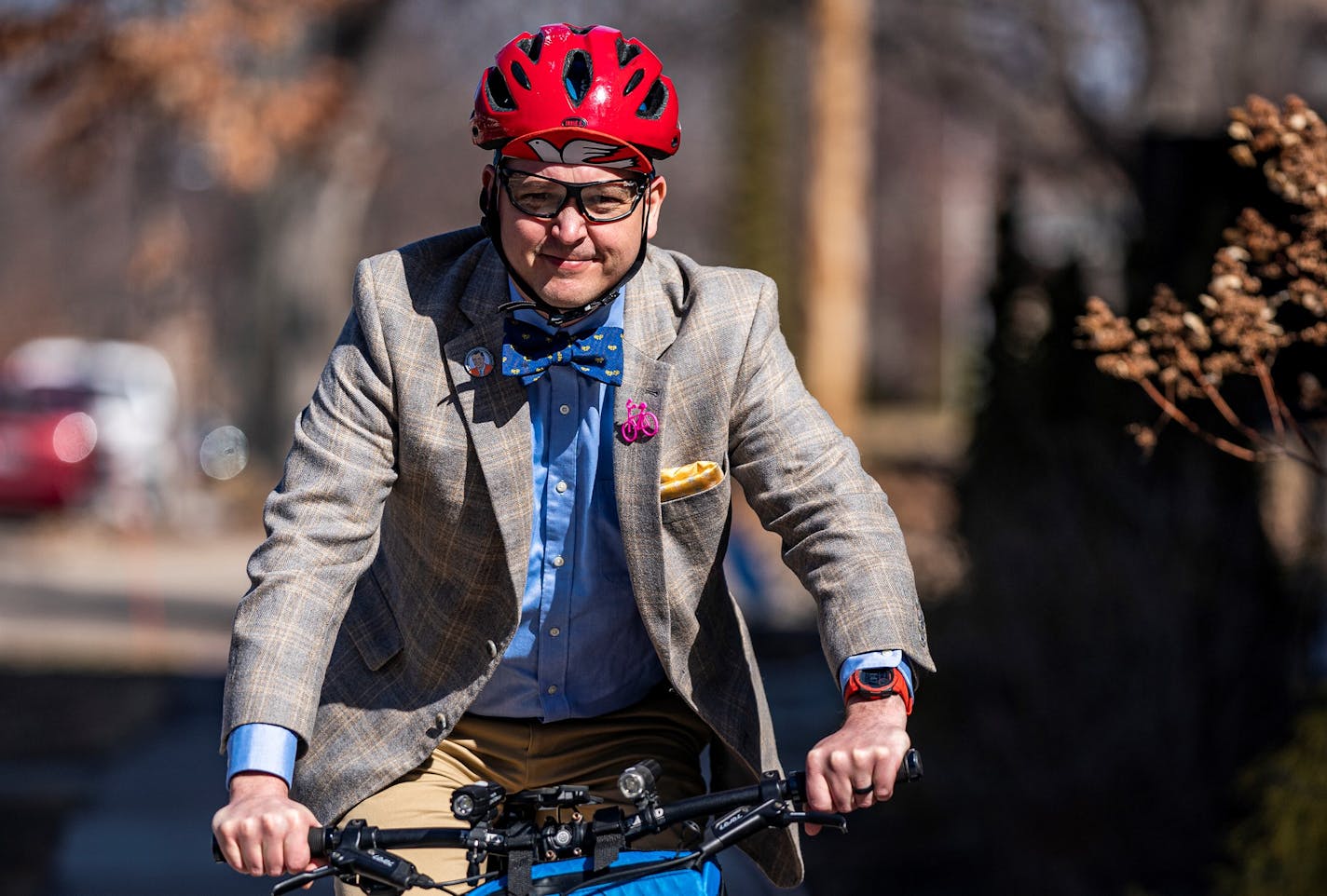 Pastor Travis Novell heads home after an after-service gathering at Judson Memorial Baptist Church in Minneapolis, Minn., on Sunday, March 20, 2022. Biking pastor Travis Novell has a new book called Church on the Move and gives bike commute updates to MPR. ] RICHARD TSONG-TAATARII • richard.tsong-taatarii@startribune.com