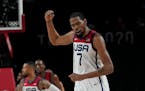Kevin Durant celebrates after a basket during the men's basketball gold medal game against France at the 2020 Summer Olympics