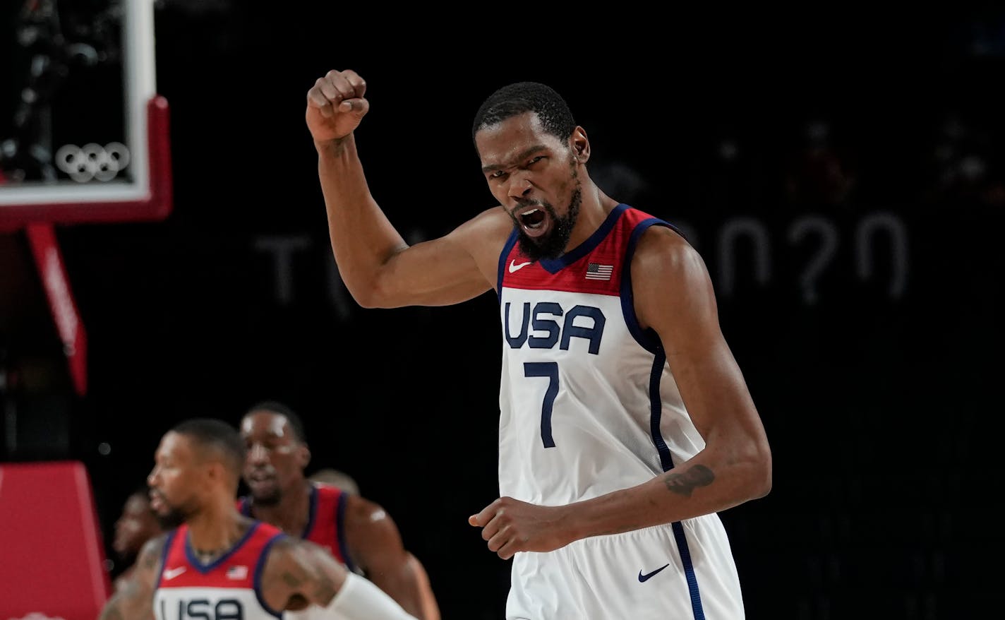 Kevin Durant celebrates after a basket during the men's basketball gold medal game against France at the 2020 Summer Olympics