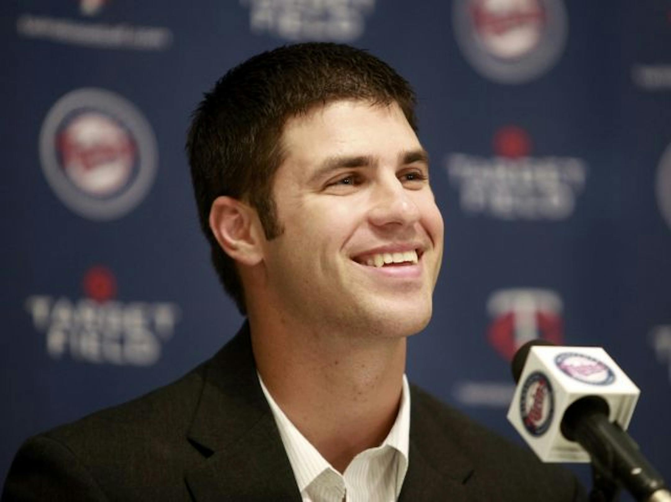 The Twins stuck by their policy of not paying deferred money on contracts in signing star catcher Joe Mauer.