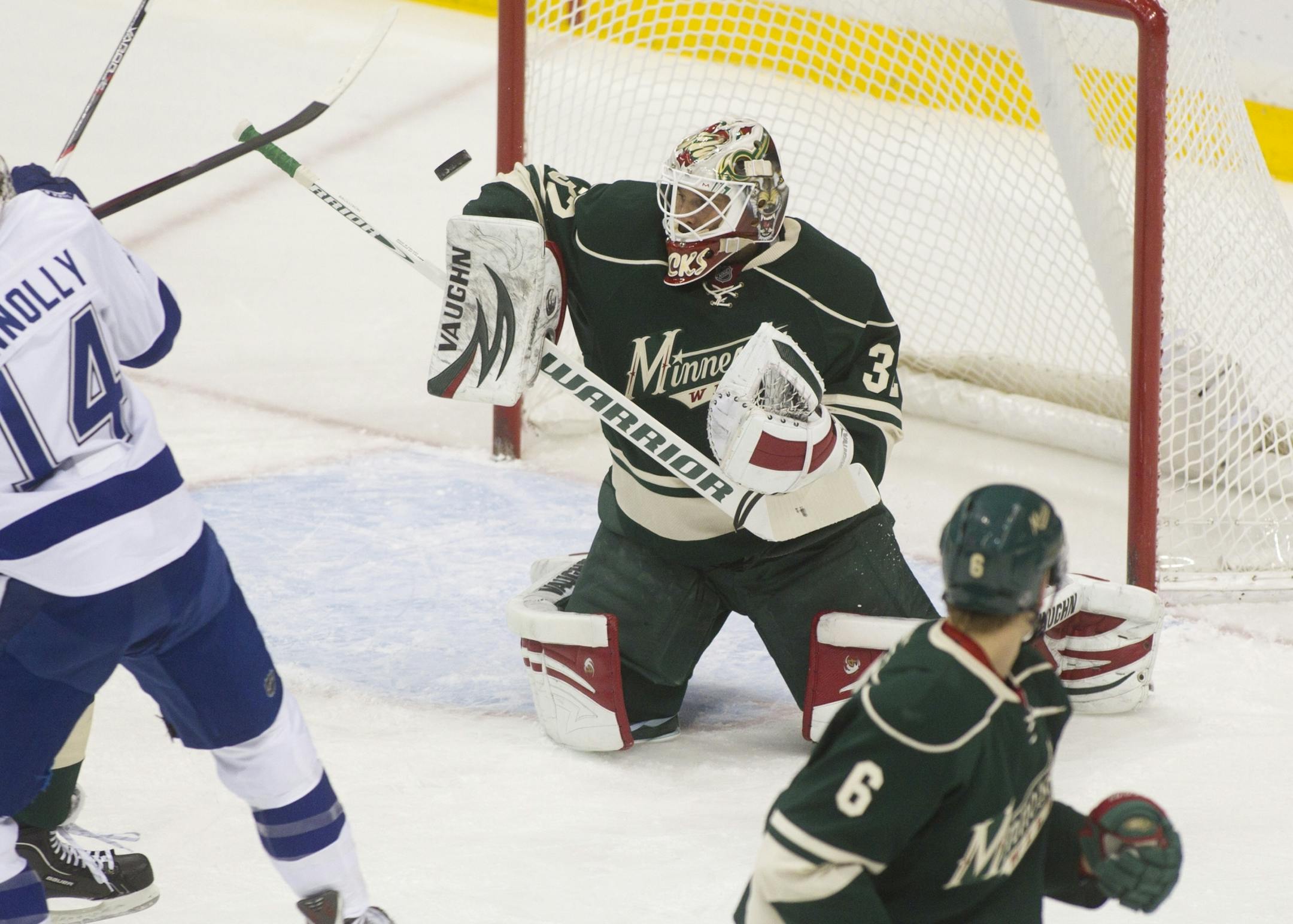 WIld goalie Niklas Backstrom stopped a point with his arm in the first period against the Tampa Bay Lightning at the Xcel Energy Center Monday, November 28, 2011, in St. Paul, Minn.