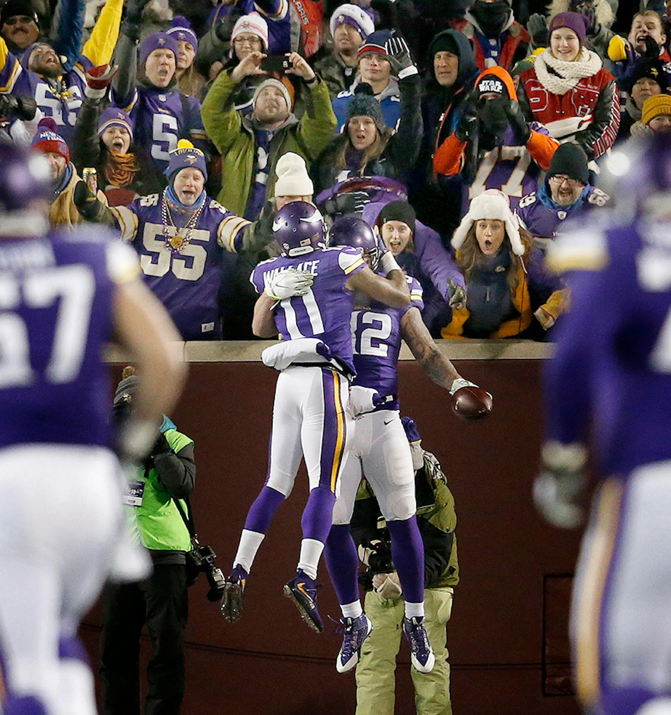 Vikings tight end Kyle Rudolph (82) celebrated with Mike Wallace (11) after scoring a 28-yard touchdown in the second quarter.