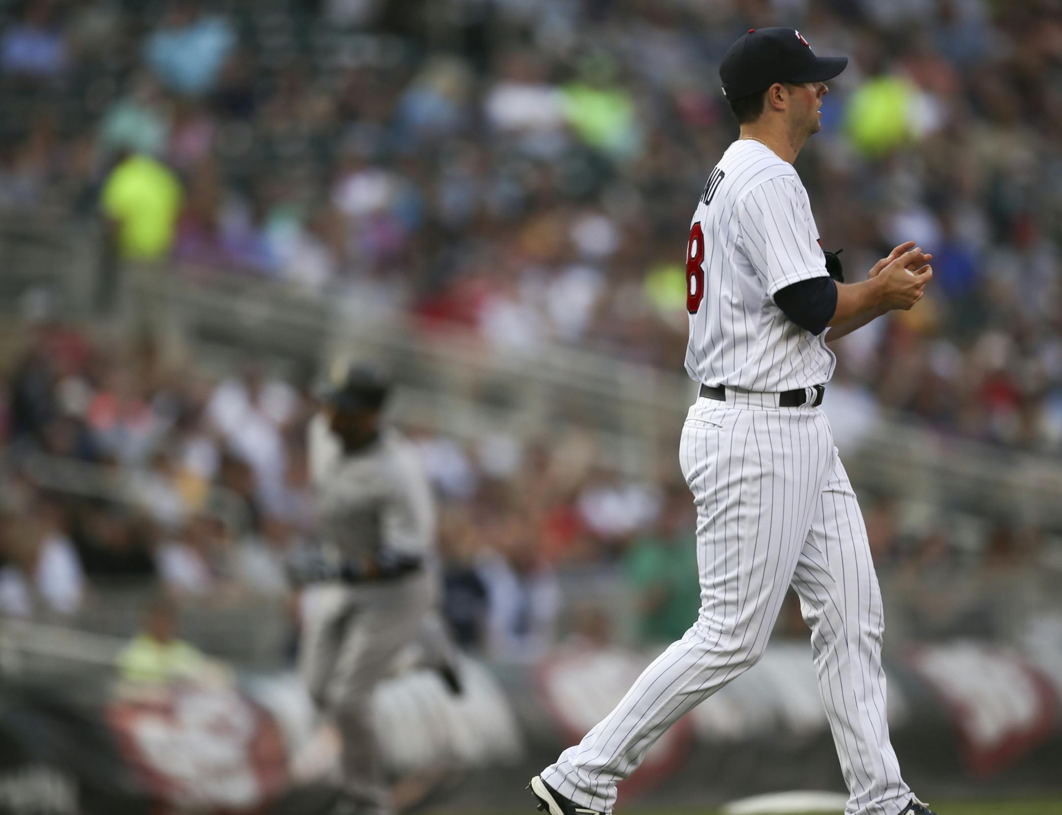 Twins starter Scott Diamond rubbed up a new baseball in the first inning while the Yankees' Robinson Cano rounded third after hitting the first of his two homers in a 10-4 New York victory.