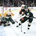 Minnesota Wild right wing Mats Zuccarello (36) took control of the puck after it was lost by defenseman Brad Hunt (77) in the second period.