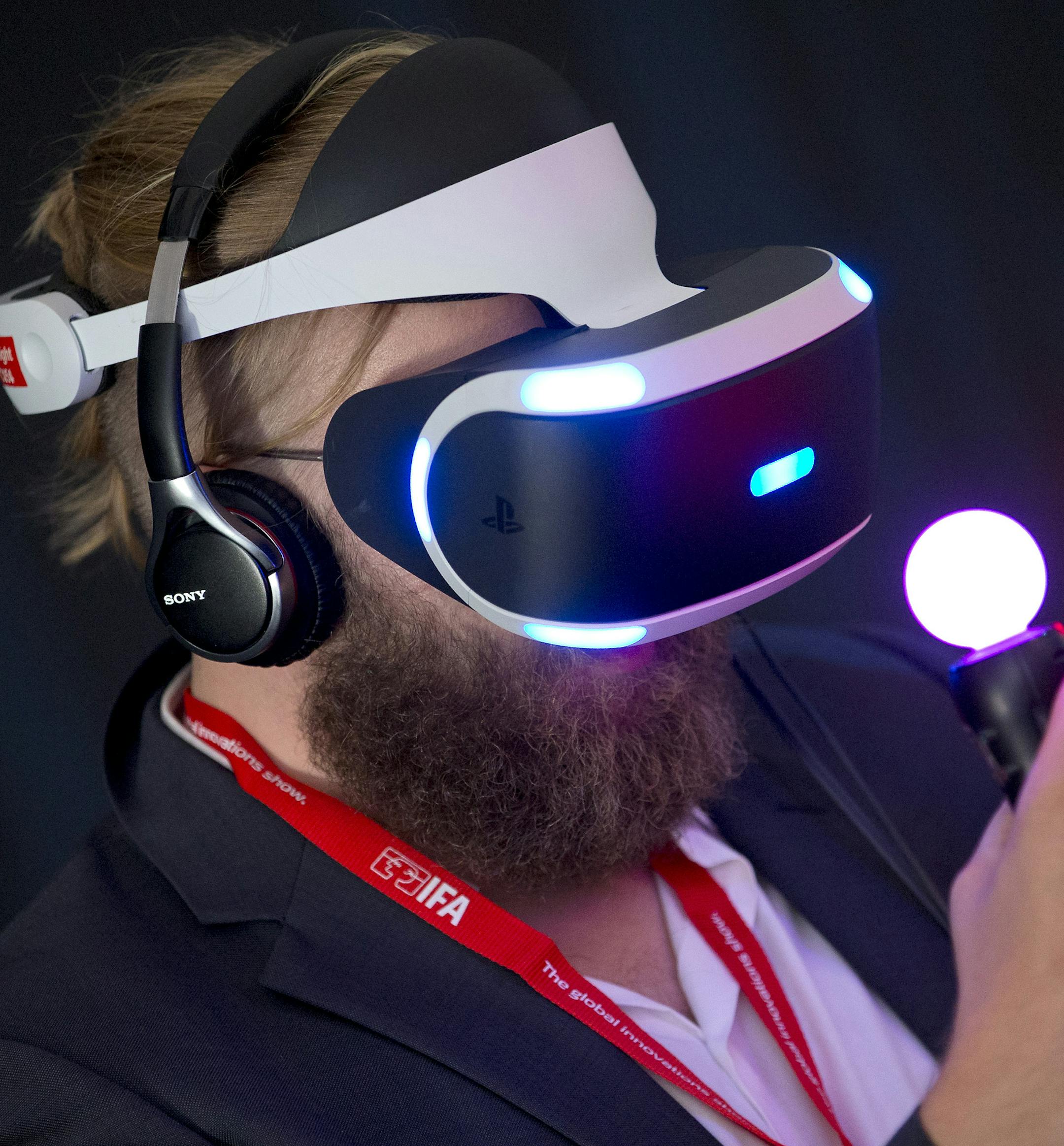 FILE - In this Sept. 2, 2015 file photo, a man tests a Sony 'Project Morpheus Virtual Reality' device after a press conference at the company's stand at the IFA 2015 tech fair in Berlin, Germany. If youíre a gamer, the appeal of immersing yourself in a virtual world might be obvious. Strap on a headset and you could find yourself in a three-dimensional death match with opponents who could - almost literally - creep up right behind you. Many leading companies are betting on VR with more soph