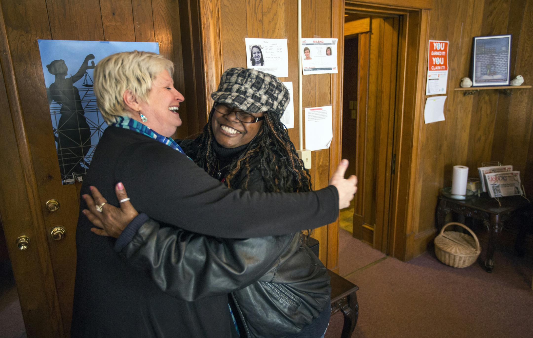 Lori Stee, director at Breaking Free in Minnesota (left), gets a hug from Damita Love at their office in St. Paul . The organization that has worked for abolishing sex trafficking since 1996, provides women's services and presentations in the community, including an education session for first-time offenders to help them understand what they did wrong. ] BRIAN PETERSON ‚Ä¢ brianp@startribune.com Minneapolis MN - 2/9/2015