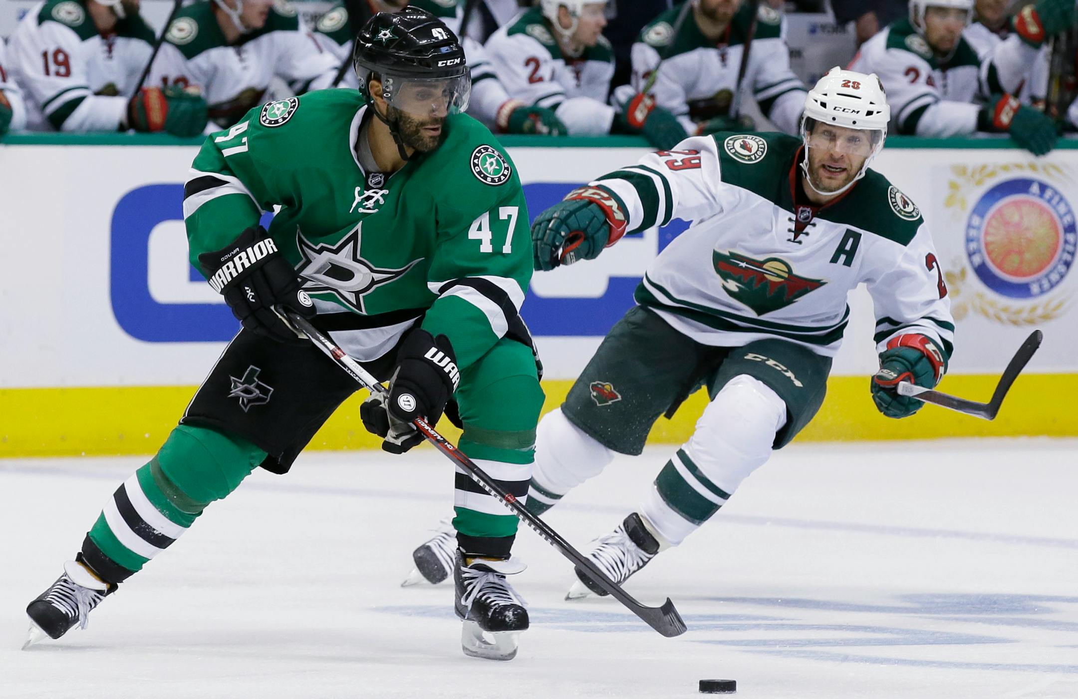 Dallas Stars defenseman Johnny Oduya (47) skates with the puck against Minnesota Wild right wing Jason Pominville (29) during the second period of Game 1.