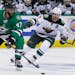Dallas Stars defenseman Johnny Oduya (47) skates with the puck against Minnesota Wild right wing Jason Pominville (29) during the second period of Gam