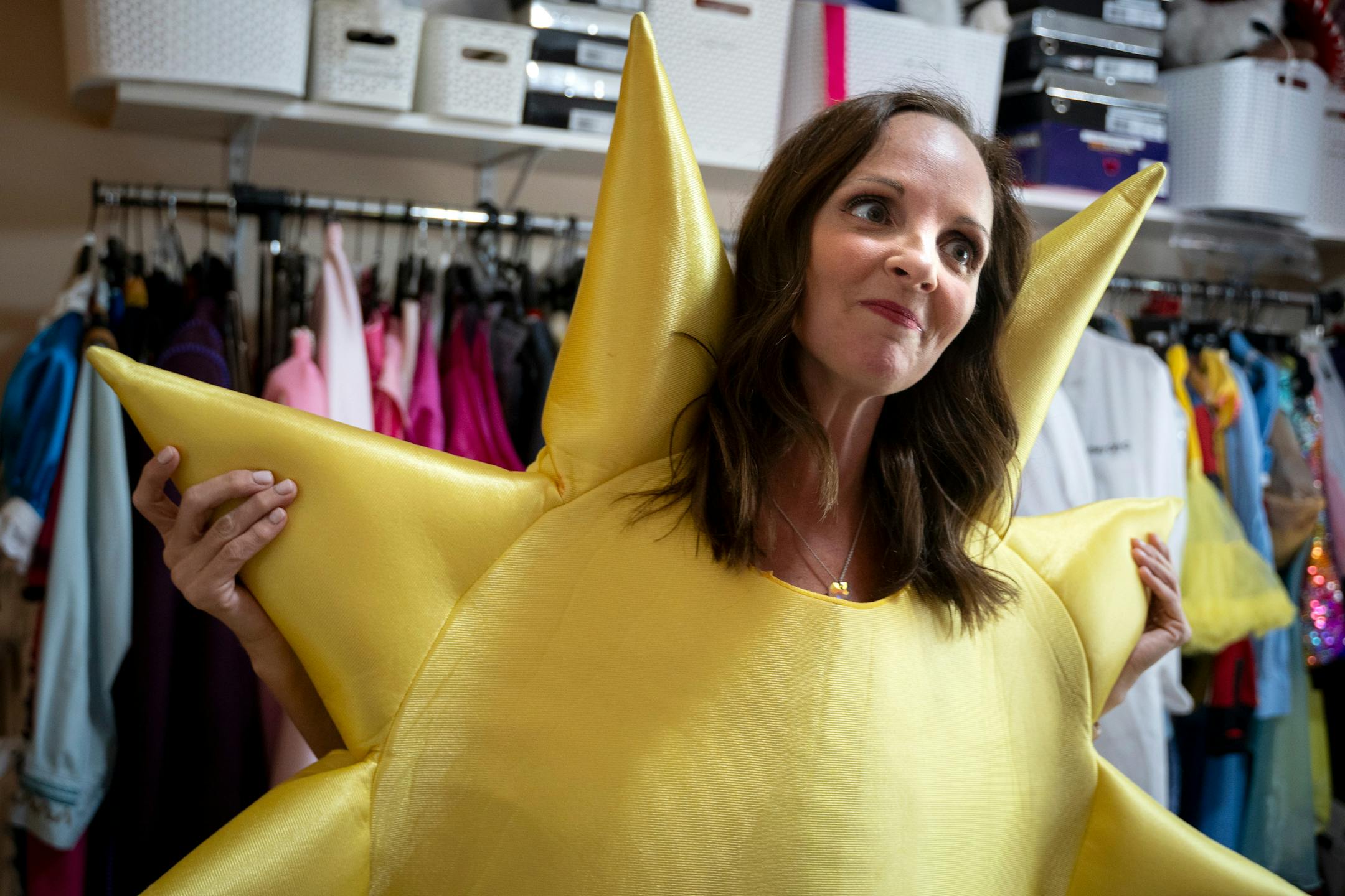 Nicole Fenstad shows off her closet full of costumes at her home in Plymouth, Minn. on Wednesday, July 26, 2023. With her background in theatre, Fenstad built Princess Party Pals and performs in character for a range of events, from preschools to 90-year-old birthday parties. ] Angelina Katsanis • angelina.katsanis@startribune.com