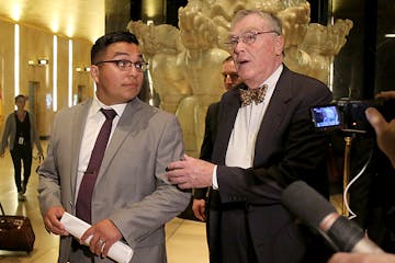 St. Anthony police officer Jeronimo Yanez, left, and his attorney Tom Kelly, right, leave the Ramsey County Courthouse, Tuesday, May 30, 2017, in St. 