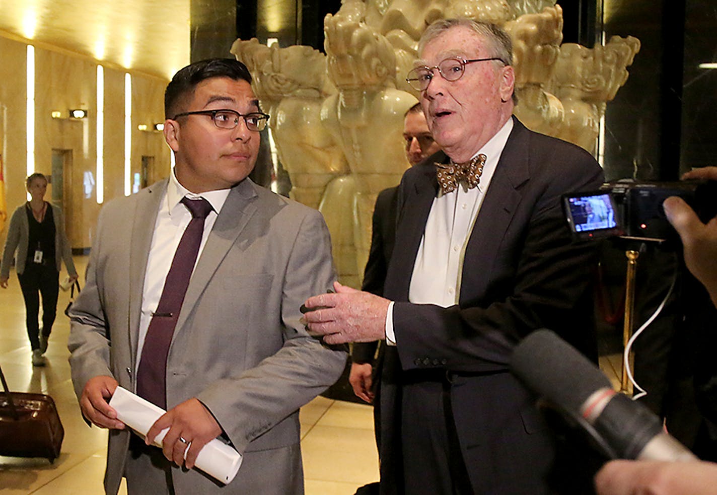 St. Anthony police officer Jeronimo Yanez, left, and his attorney Tom Kelly, right, leave the Ramsey County Courthouse, Tuesday, May 30, 2017, in St. Paul.