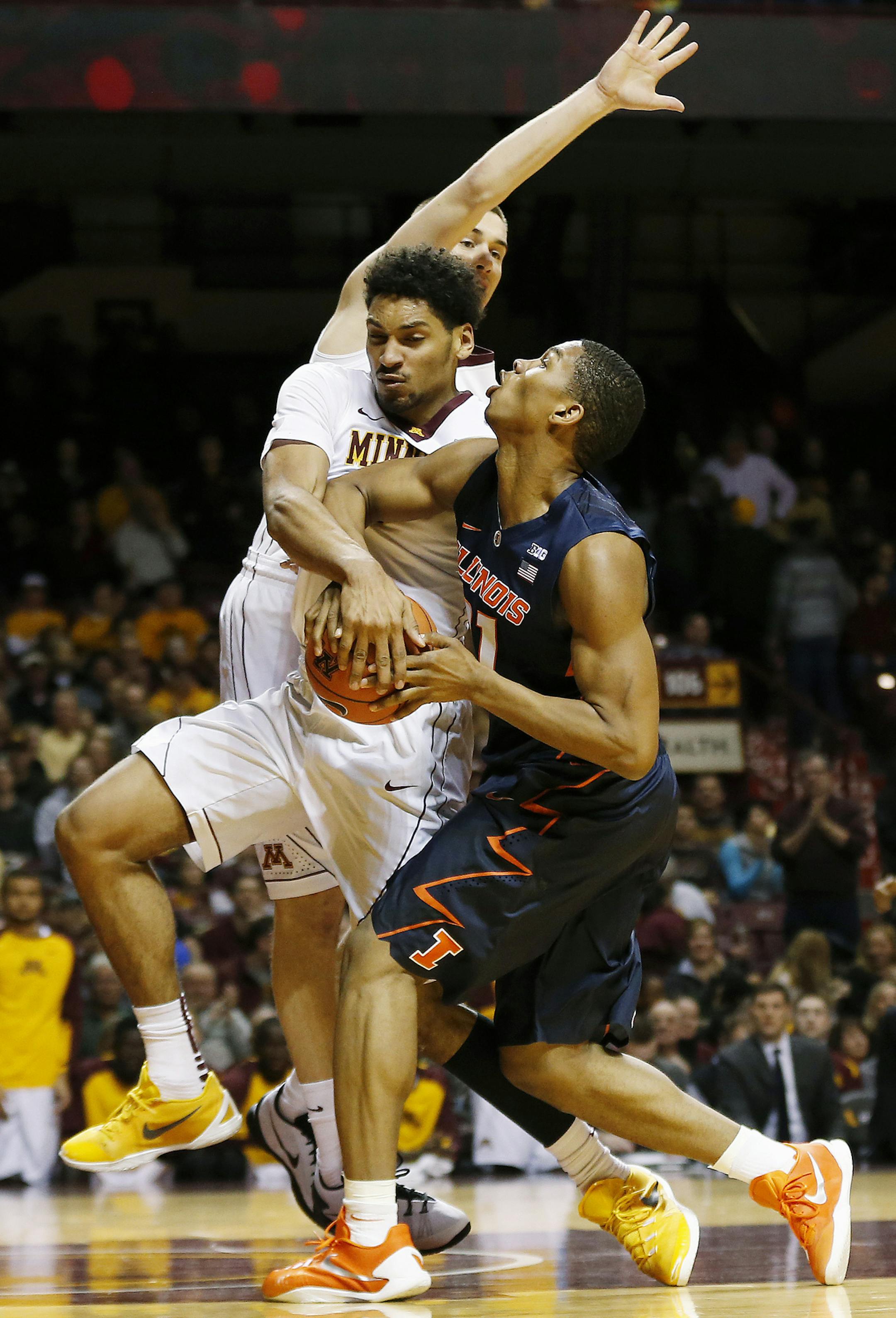 Illinois guard Malcolm Hill (21) is fouled by Minnesota forward Jordan Murphy (3) in the first half of an NCAA college basketball game Saturday, Jan. 23, 2016 in Minneapolis. (AP Photo/Stacy Bengs)