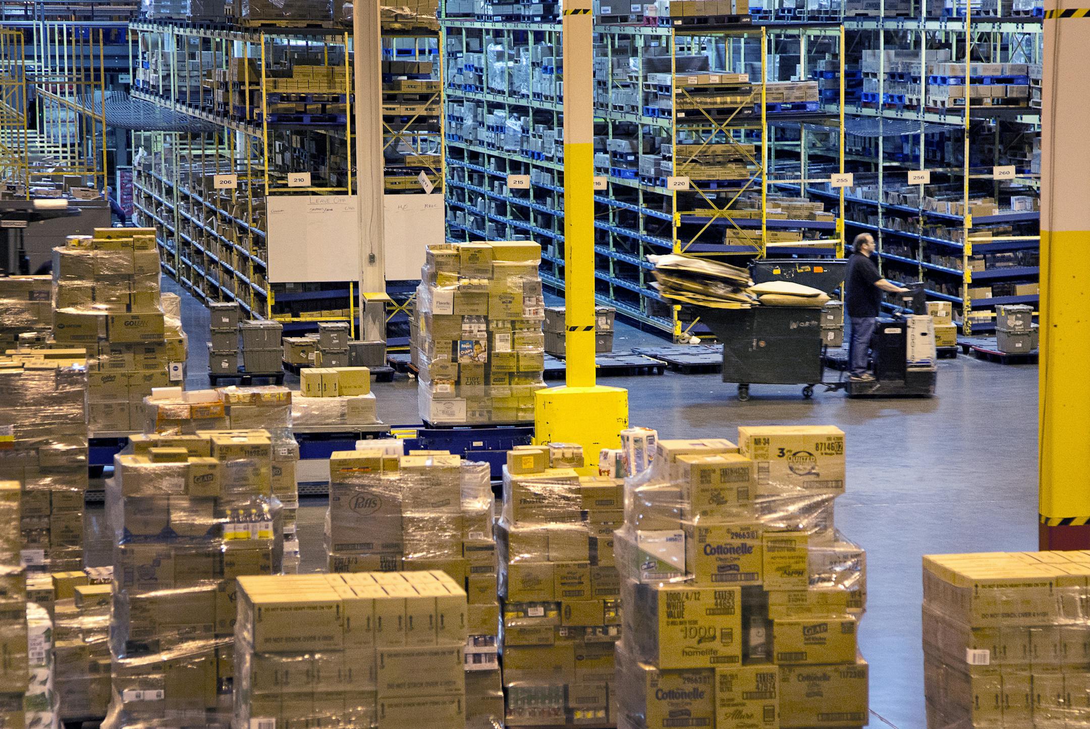 Goods are sorted and stacked at the loading dock of a Supervalu Inc. distribution center in Hopkins, Minnesota on Monday, Jan. 9, 2012. Inventories at U.S. wholesalers rose 0.1 percent following a 1.2 percent revised gain in October, Commerce Department figures showed today in Washington. Photographer: Ariana Lindquist/Bloomberg ORG XMIT: 136862452