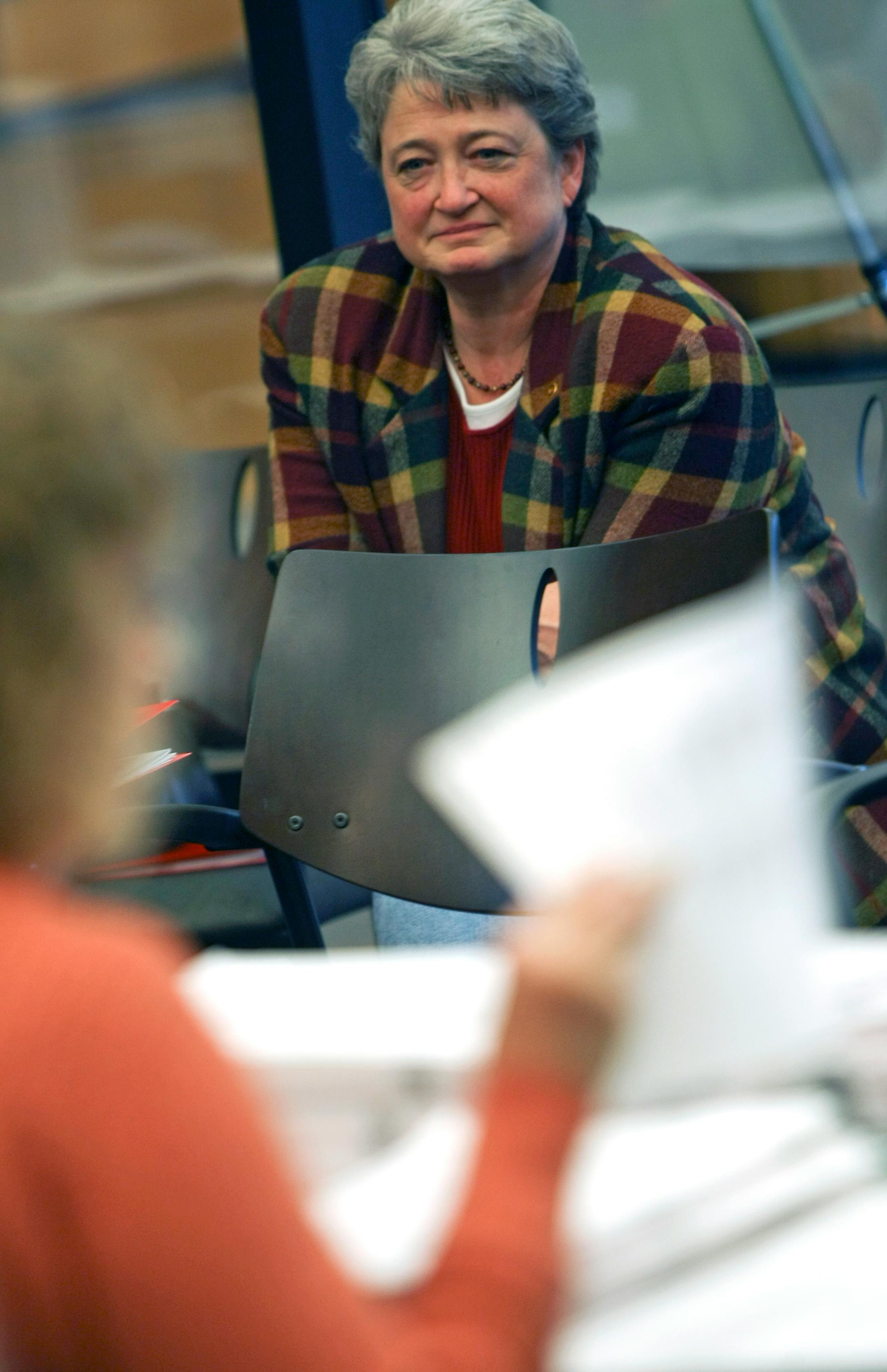 Candidate Mary Brindle watched from the back of the room as election officials recounted the vote totals between her and Josh Sprague, who also was on hand. He was entitled to the recount because less than .5 percent of the vote total separated him from Brindle.