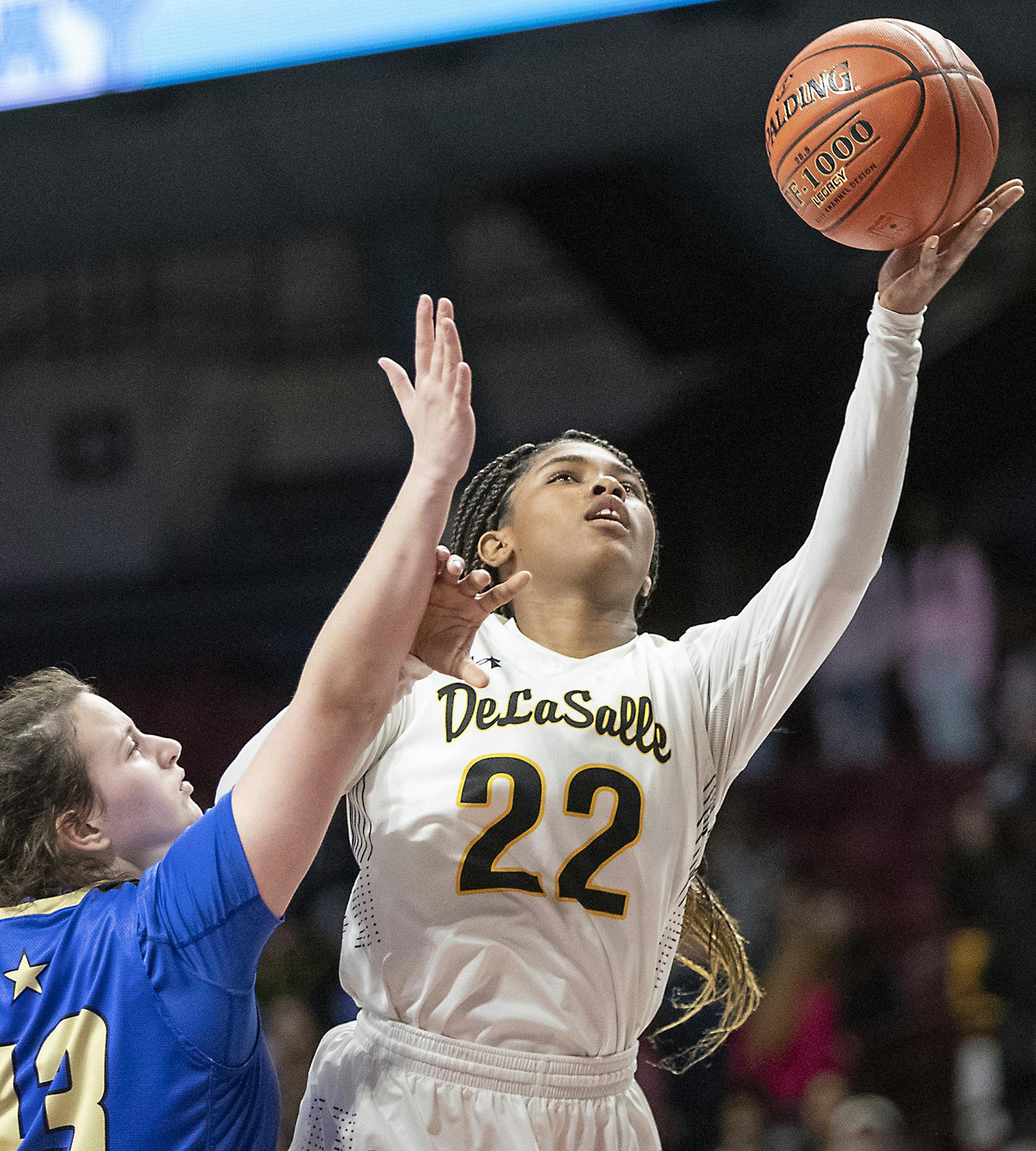 DeLaSalle's Nurjei Weems went up for two despite defensive efforts by Academy of Holy Angels' Emma Mastre during the second period of their match-up of the Class 3A girls' basketball state tournament semifinals at Williams Arena, Thursday, March 14, 2019 in Minneapolis, MN. ] ELIZABETH FLORES &#x2022; liz.flores@startribune.com