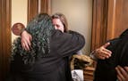 Sexual assault survivor Sarah Super of Break the Silence hugs Rep. Aisha Gomez (DFL-Minneapolis) after testifying about eliminating the statute of lim
