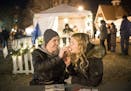 Brett Boldt and Madison Piller, of Plymouth, shared an apple turnover Friday night at Holidazzle.