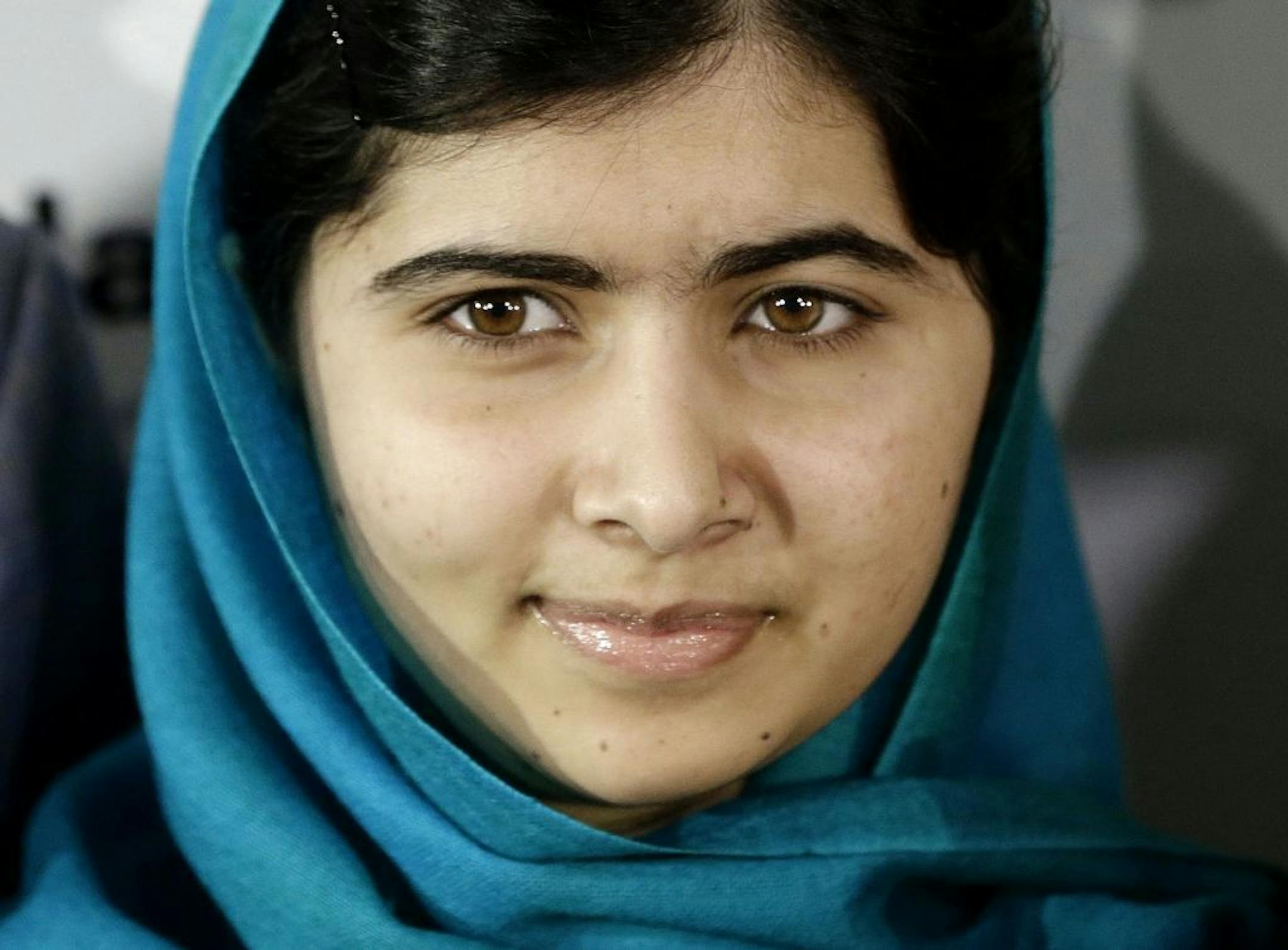 FILE - In this Oct. 10, 2013, file photo, Malala Yousafzai poses for photographs in New York.