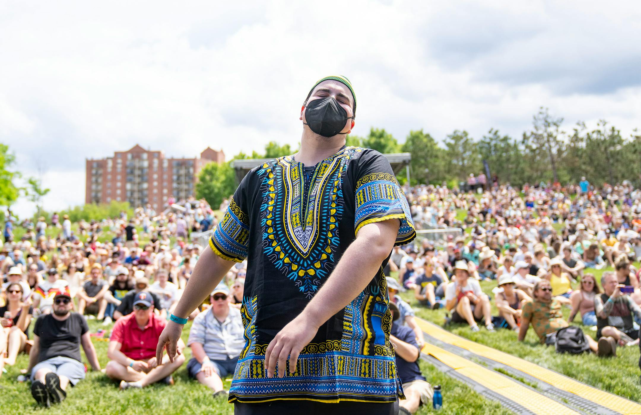 Nabil Azzouzi dances while Bombino performs during Rock the Garden.