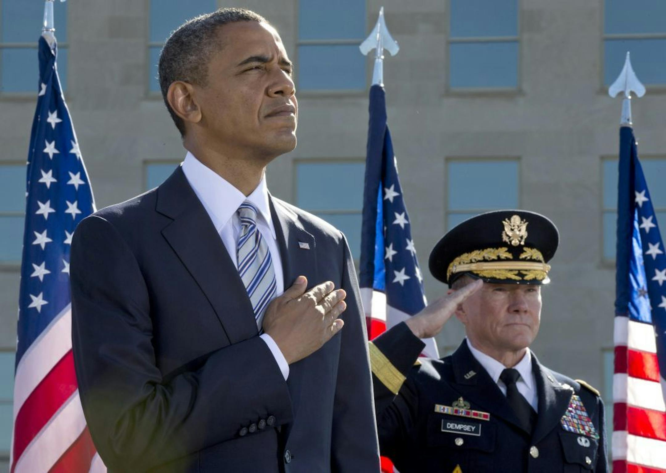 President Barack Obama and Joint Chiefs Chairman Gen. Martin Dempsey participate in a ceremony at the Pentagon Memorial,Tuesday, Sept. 11, 2012, to mark the 11th anniversary of the 9/11 attacks.