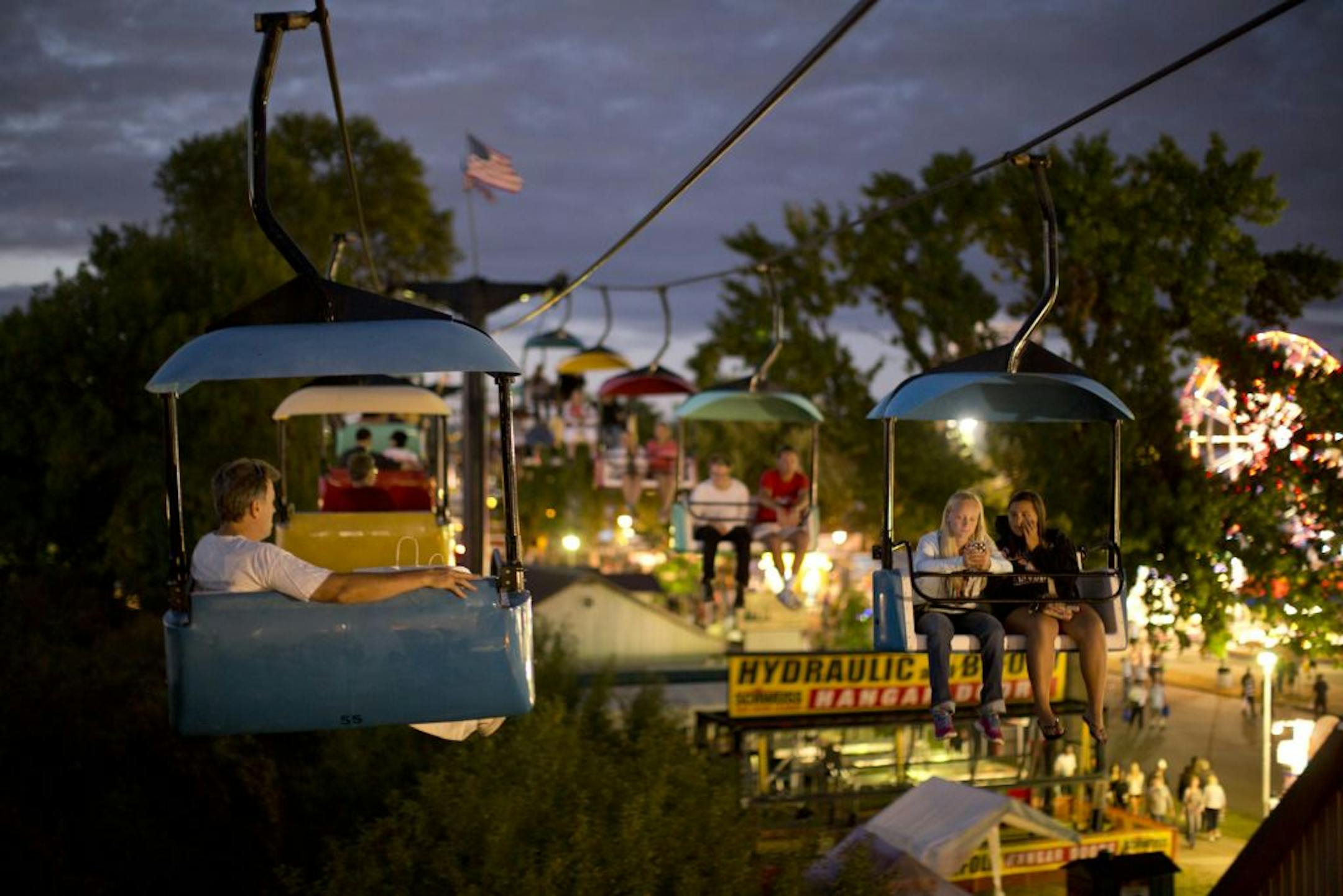 The Minnesota State Fair began winding down its 2013 run on Sunday, September 1, 2013 with cool temperatures providing pleasant relief for record breaking crowds. Riding the Sky Glider after sunset Sunday night, the day an all-time attendance record was set at the Minnesota State Fair.