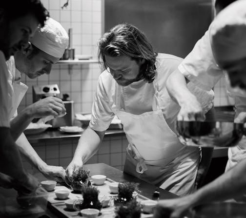 Magnus Nilsson and crew plating Porridge of grains and seeds from Jämtland finished with a lump of salty butter. Photograph: Erik Olsson ORG XMIT: MIN2010261355580132