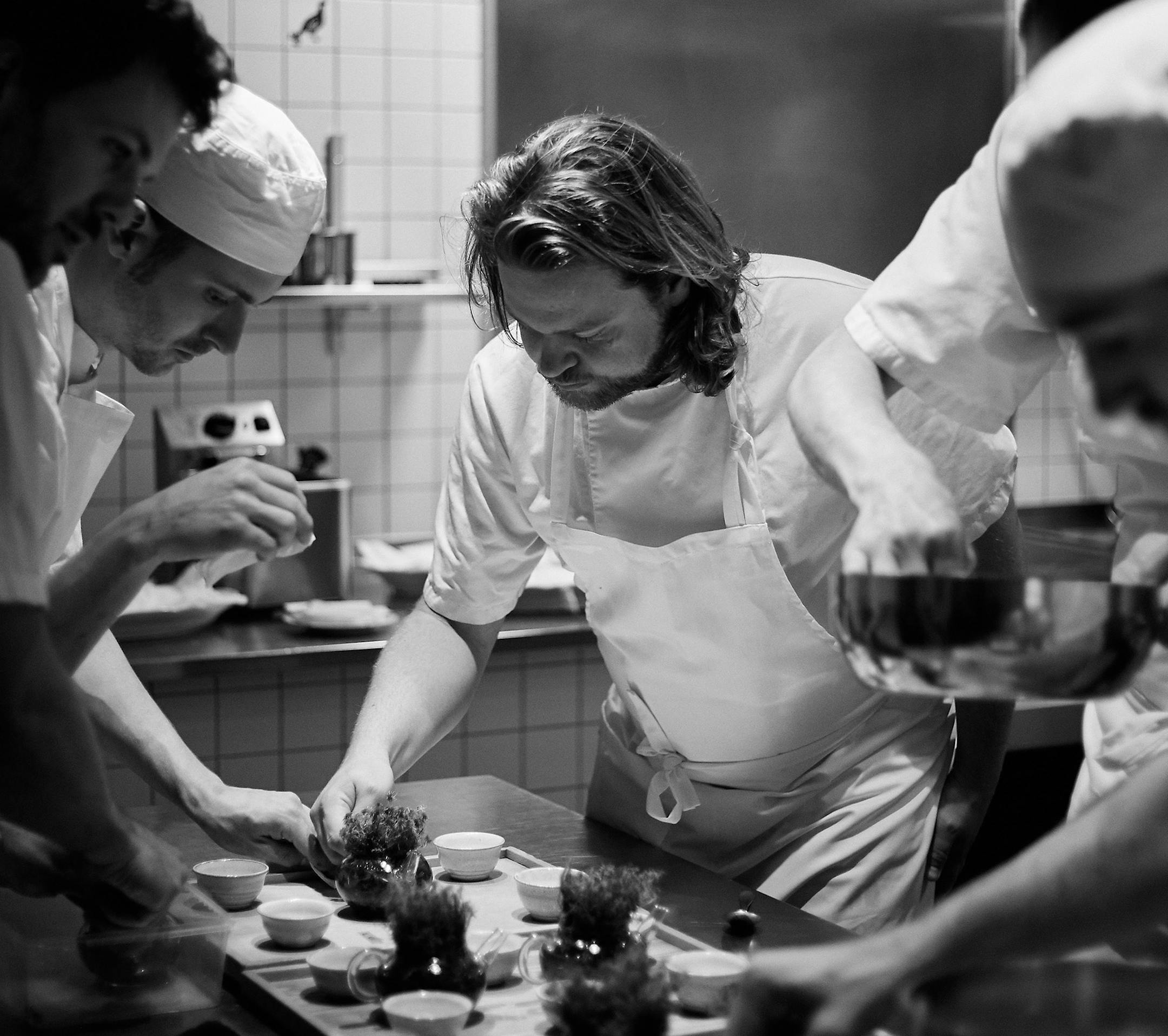 Magnus Nilsson and crew plating Porridge of grains and seeds from Jämtland finished with a lump of salty butter. Photograph: Erik Olsson ORG XMIT: MIN2010261355580132