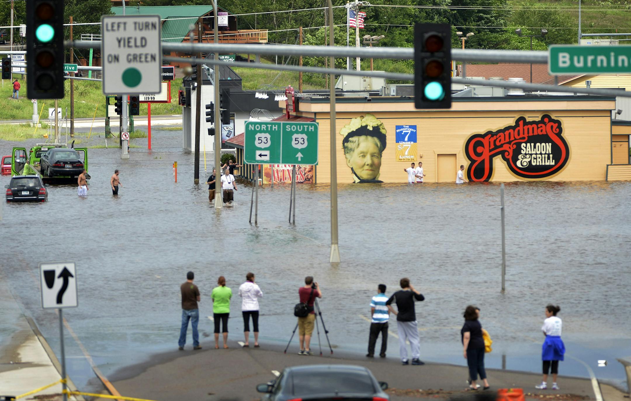 With over 9 inches of rain overnight and into Wednesday morning in Duluth Washouts, sinkholes and mudslides have taxed area roads. Many government buildings and businesses are closed. Here, flood waters cover the roads near Hwy 53 and Miller Hill Mall. ] BRIAN PETERSON &#xef; brianp@startribune.com Duluth, MN - 06/20/2012 ORG XMIT: MIN2012122712175960