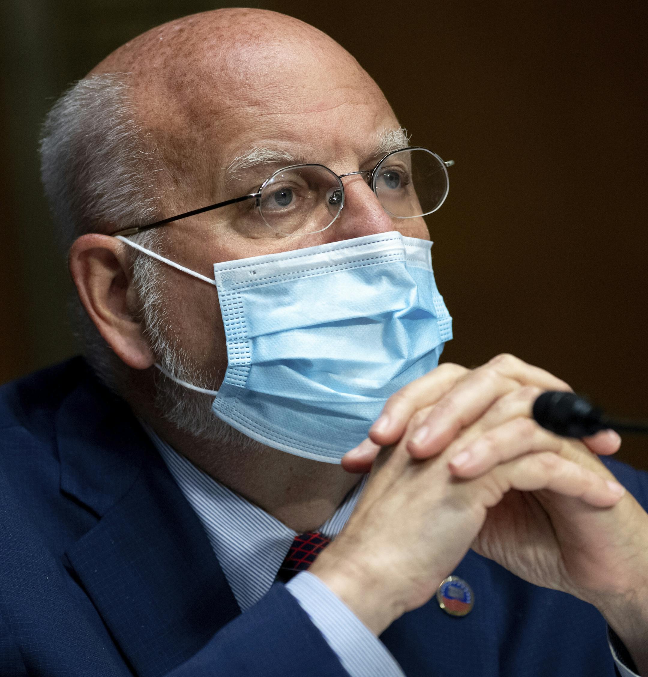 Dr. Robert Redfield, Director of the Centers for Disease Control and Prevention (CDC), testifies during a Senate Appropriations subcommittee hearing on the plan to research, manufacture and distribute a coronavirus vaccine, known as Operation Warp Speed, July 2, 2020, on Capitol Hill in Washington. When President Donald Trump convened a recent coronavirus roundtable on how to safely reopen schools, the seats surrounding him were filled with parents, teachers and local health officials. The head