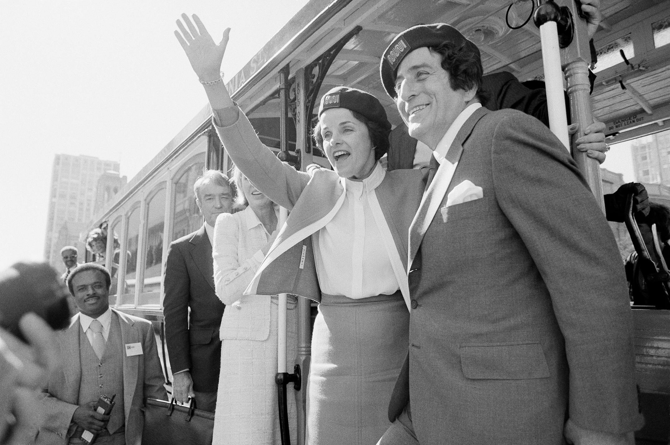 San Francisco Mayor Dianne Feinstein and singer Tony Bennett, who sang " I Left My Heart in San Francisco," hangs on to the outside of a cable car in San Francisco before taking a test ride, Wednesday, May 2, 1984. Bennett, the eminent and timeless stylist whose devotion to classic American songs and knack for creating new standards such as "I Left My Heart In San Francisco" graced a decades-long career that brought him admirers from Frank Sinatra to Lady Gaga.