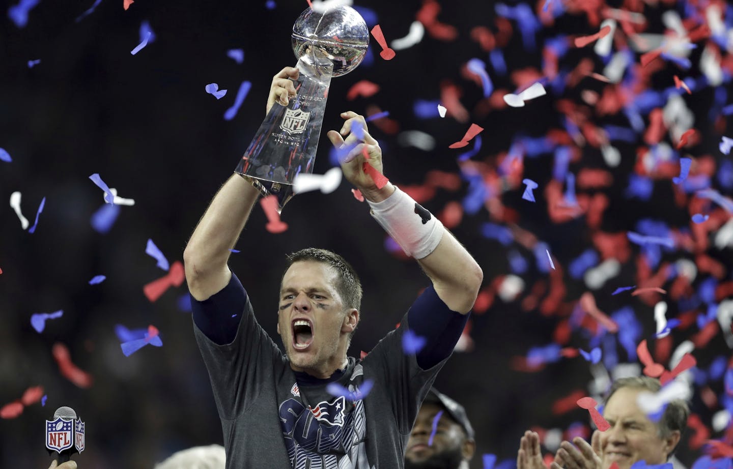 New England Patriots' Tom Brady raises the Vince Lombardi Trophy after defeating the Atlanta Falcons in overtime at the NFL Super Bowl 51 football game Sunday, Feb. 5, 2017, in Houston. The Patriots defeated the Falcons 34-28. (AP Photo/Darron Cummings)