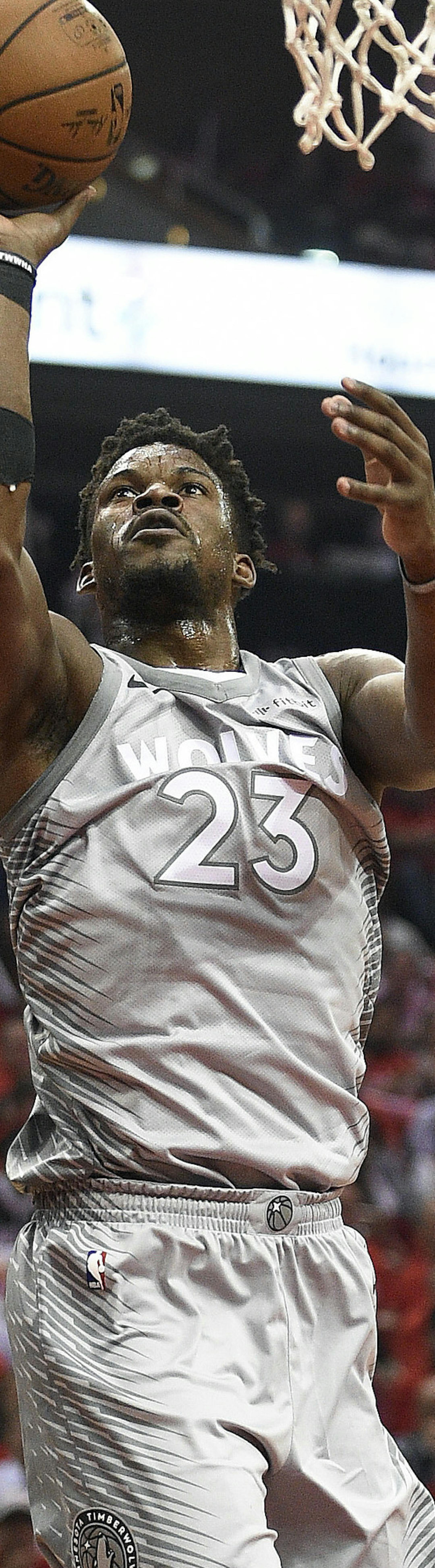Minnesota Timberwolves guard Jimmy Butler (23) drives to the basket as Houston Rockets guard Chris Paul (3) watches during the first half in Game 2 of a first-round NBA basketball playoff series Wednesday, April 18, 2018, in Houston. (AP Photo/Eric Christian Smith)