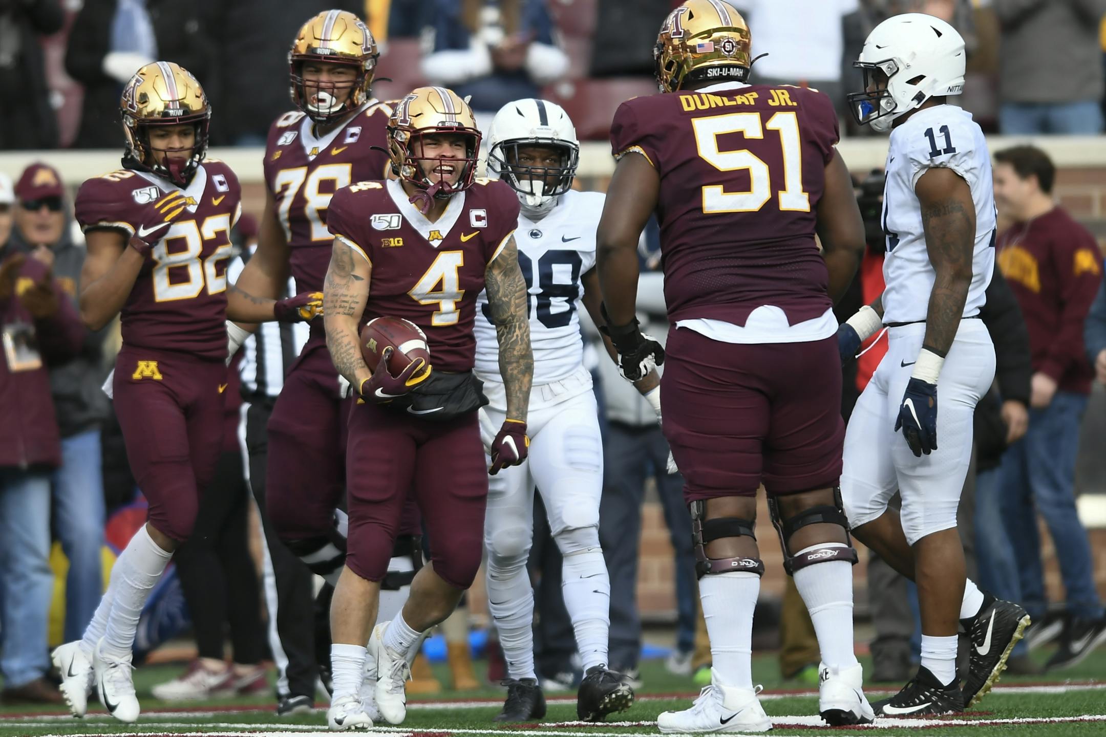 Minnesota Gophers running back Shannon Brooks (4) celebrated a first down in the first half.