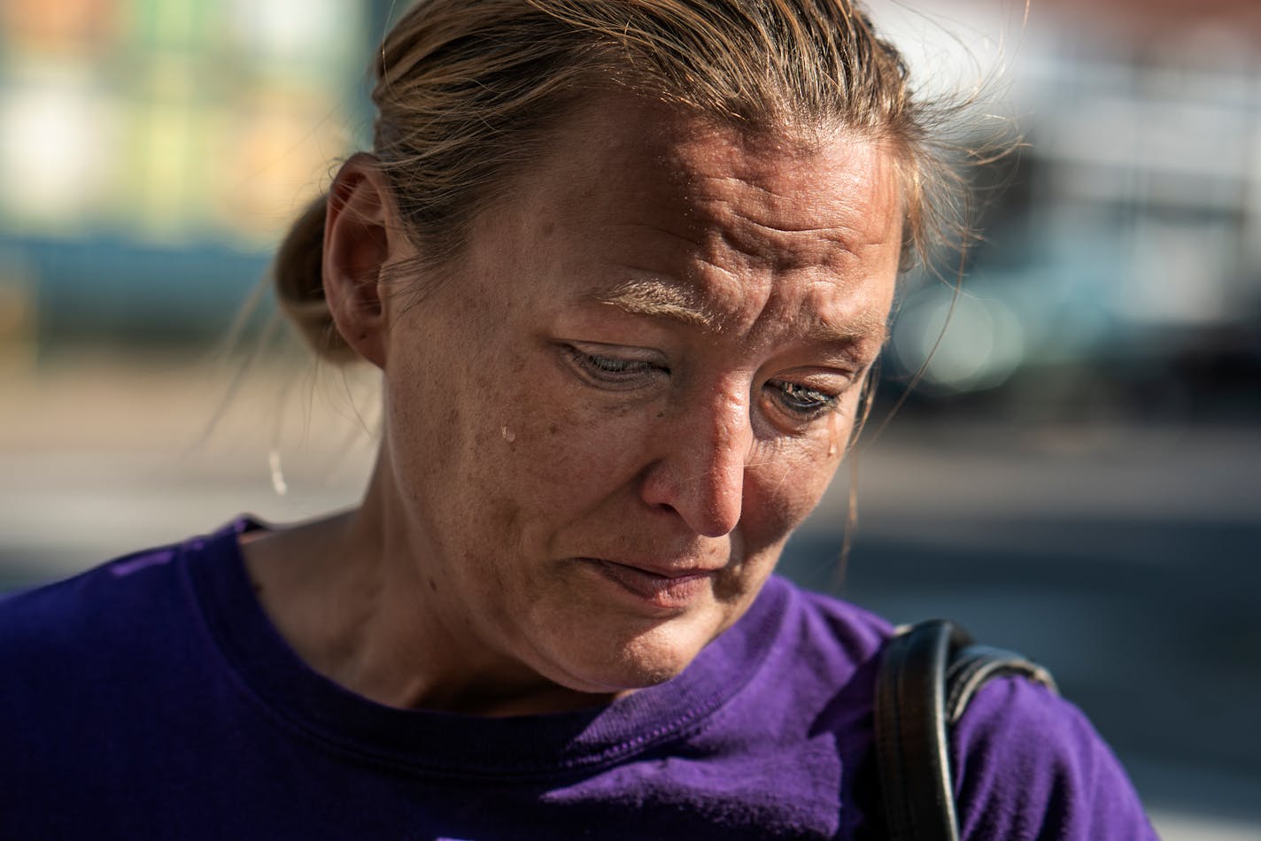 Natasha Gunderson became emotional recalling her cousin Kimberly Gunderson, who died in a vehicular crash early Sunday, Sept. 23, 2018 in Minneapolis. The Minnesota State Patrol says three people were killed when a stolen SUV driven by a teenager crashed into their pickup at an intersection in south Minneapolis. (Richard Tsong-Taatarii/Star Tribune via AP)