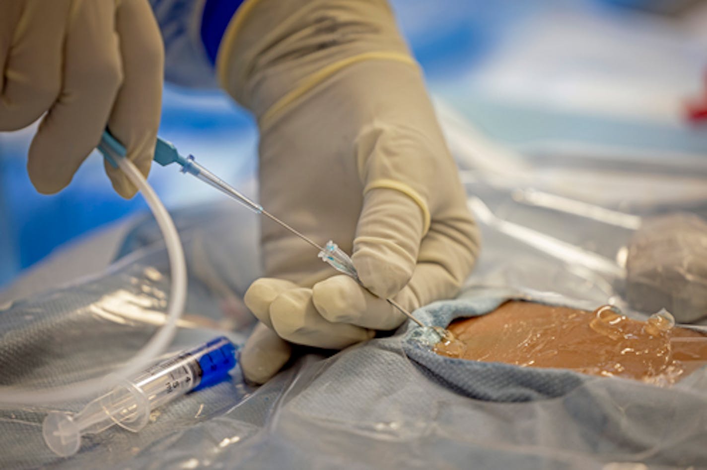 Infectious disease doctor Jeff Dichter, participated in a drill to practice inserting central venous catheters while wearing full PPE at M Health Fairview, in Minneapolis, Minn., on Wednesday, July 13, 2022. ] Elizabeth Flores • liz.flores@startribune.com